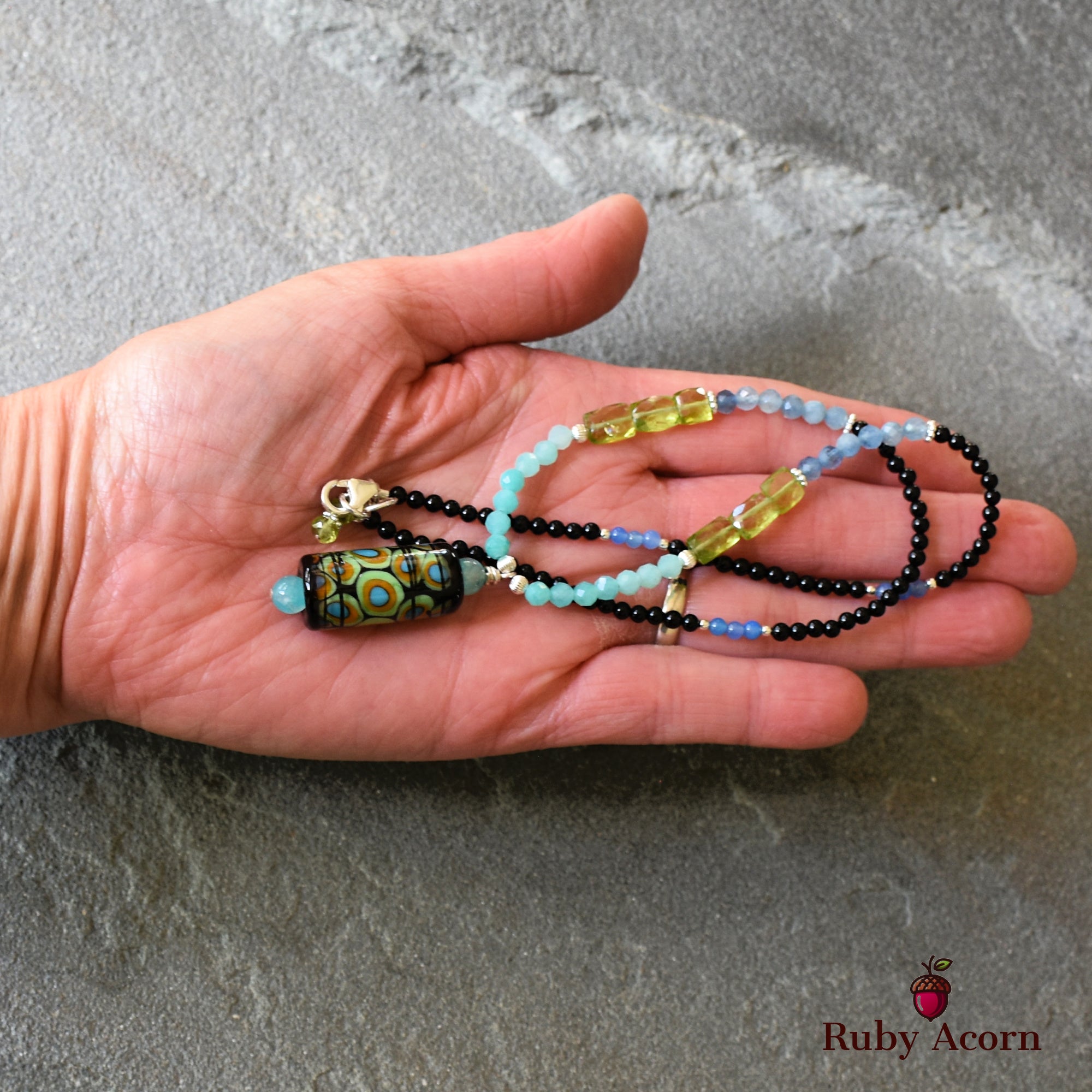 This image shows a necklace. The jewelry piece has a pendant and a clasp, which are characteristic of necklaces rather than earrings or bracelets.