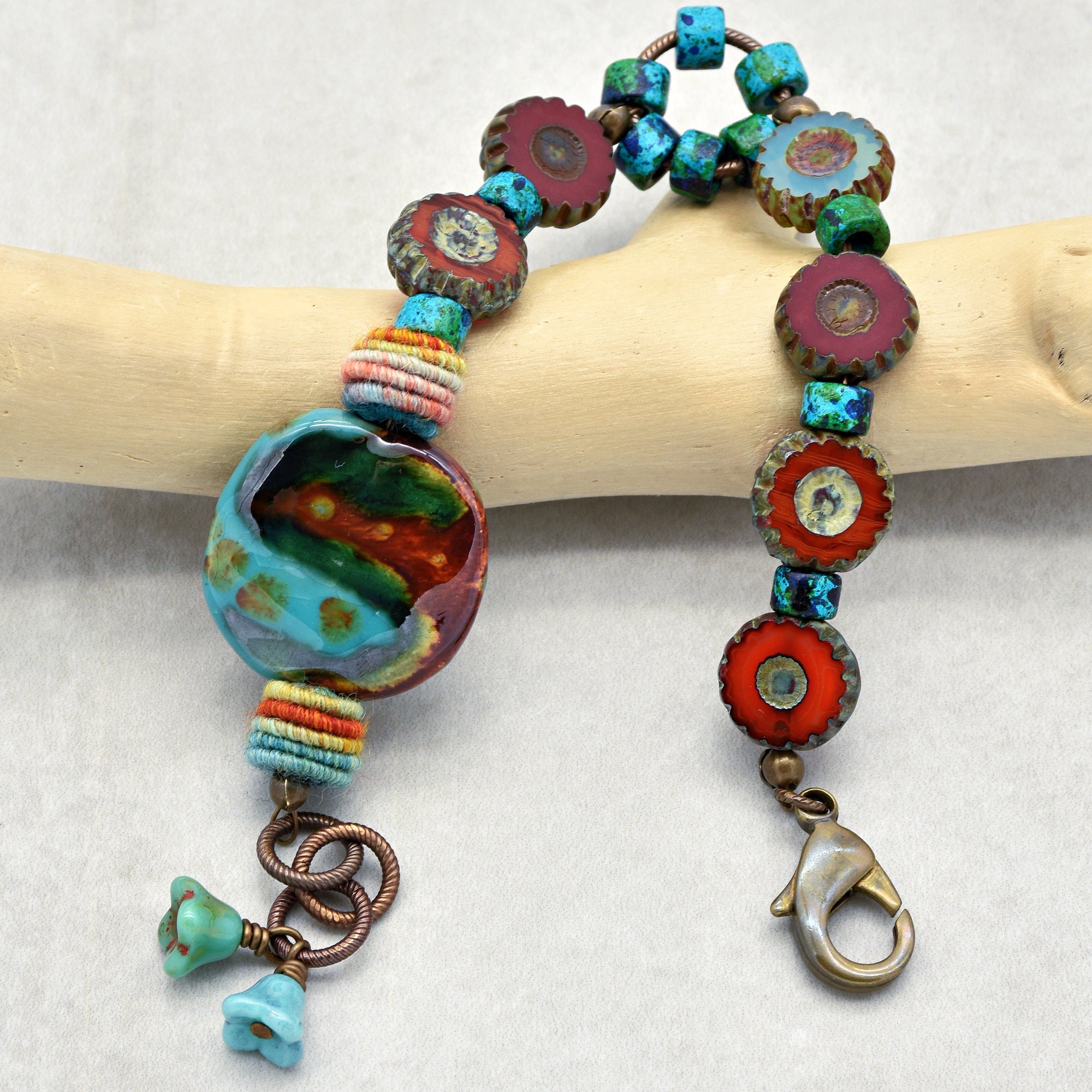This image shows a piece of jewelry with a clasp and beads that appears to be a bracelet. The size and design suggest it wraps around the wrist.