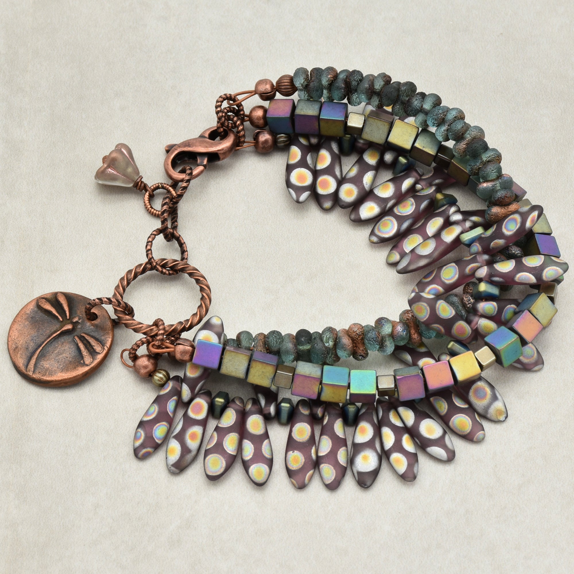 The jewelry in the image is a bracelet. It has multiple strands with beads and decorative elements, and a clasp for fastening around the wrist.