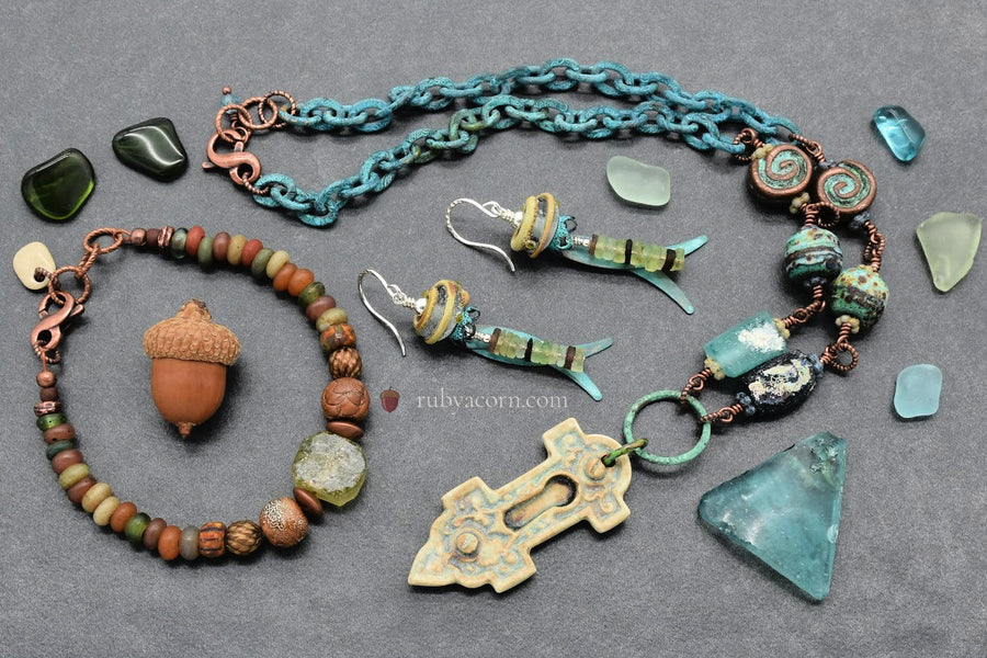 Ancient Roman Glass jewelry collection — necklace, bracelet, and earrings — handmade by Ruby Acorn
