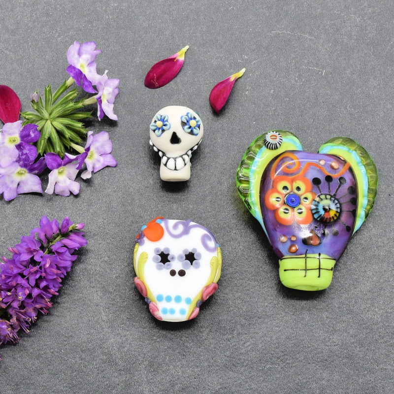 Colorful sugar skull beads flat lay | Día de los Muertos Jewelry Collection | Ruby Acorn