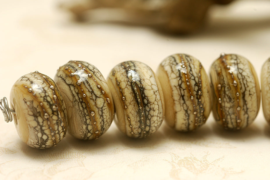 Dark ivory and silver handmade lampwork rondelle beads by Grace Ma, set of seven, 9mm x 14mm, available in Maker's Corner at Ruby Acorn
