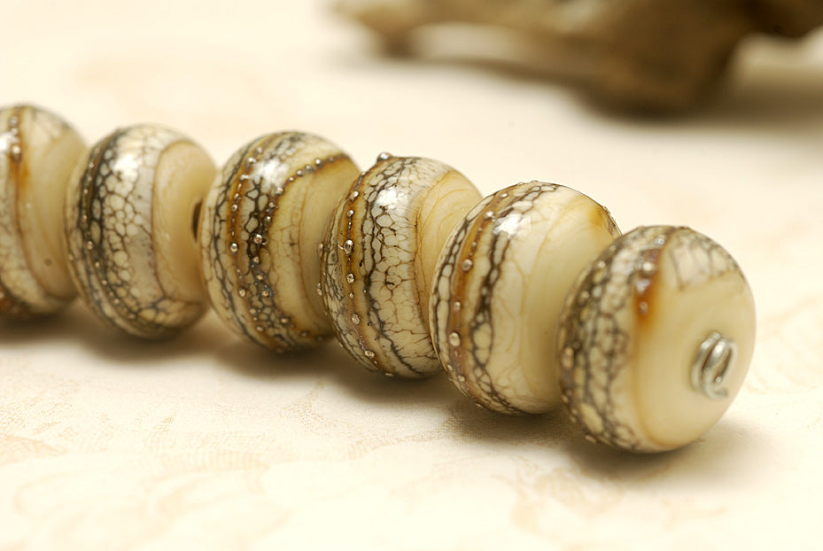 Dark ivory and silver handmade lampwork rondelle beads by Grace Ma, set of seven, 9mm x 14mm, available in Maker's Corner at Ruby Acorn