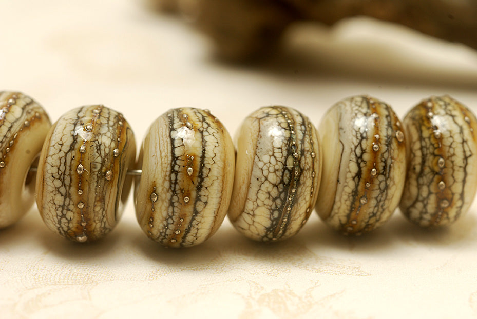 Dark ivory and silver handmade lampwork rondelle beads by Grace Ma, set of seven, 9mm x 14mm, available in Maker's Corner at Ruby Acorn