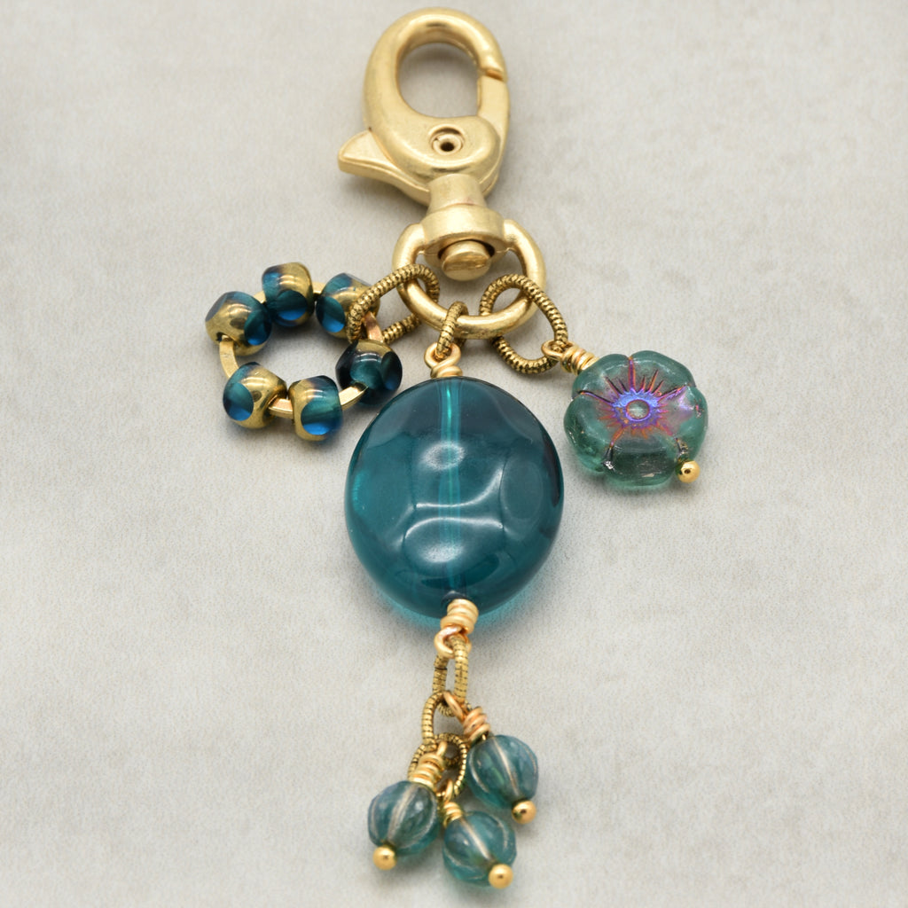 Aqua Blue handbag charm with gold swivel lobster claw on a light background - handmade with love by Ruby Acorn