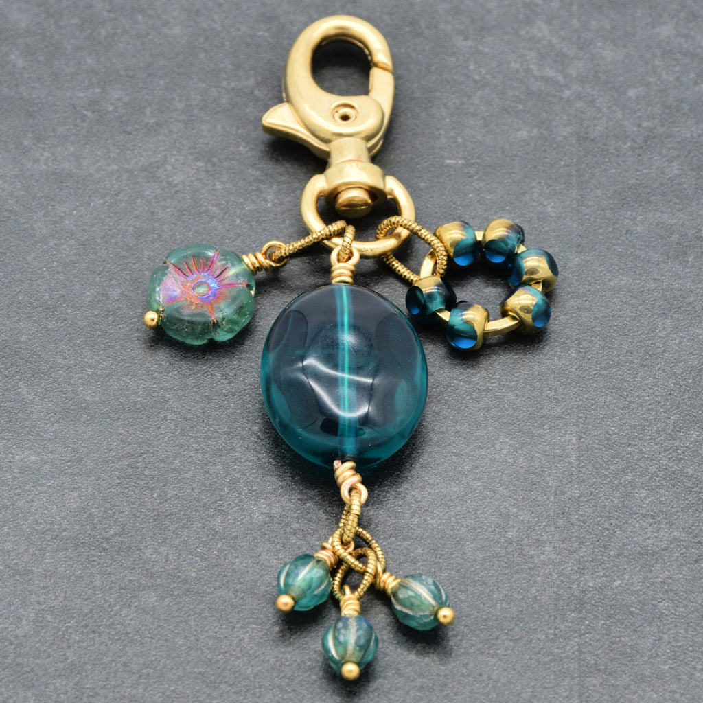 Aqua Blue handbag charm with gold swivel lobster claw on a gray background - handmade with love by Ruby Acorn