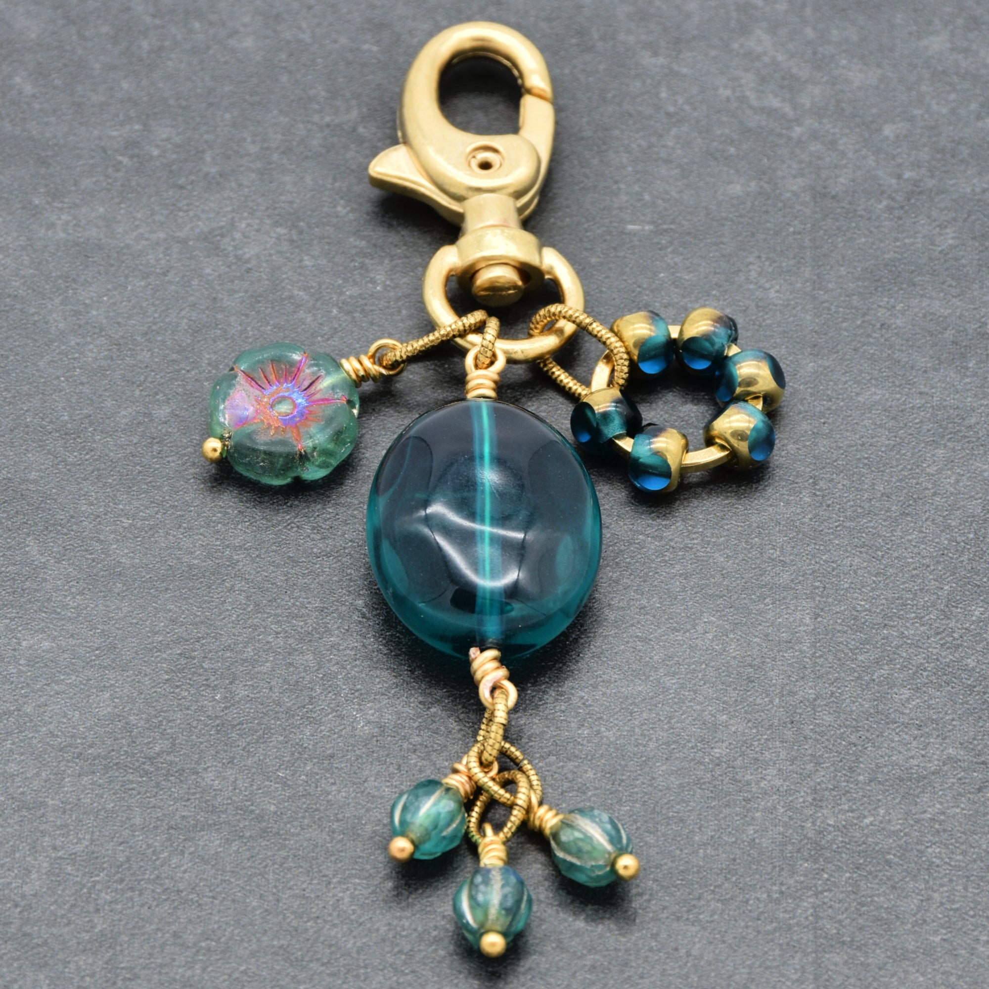 Aqua Blue handbag charm with gold swivel lobster claw on a gray background - handmade with love by Ruby Acorn