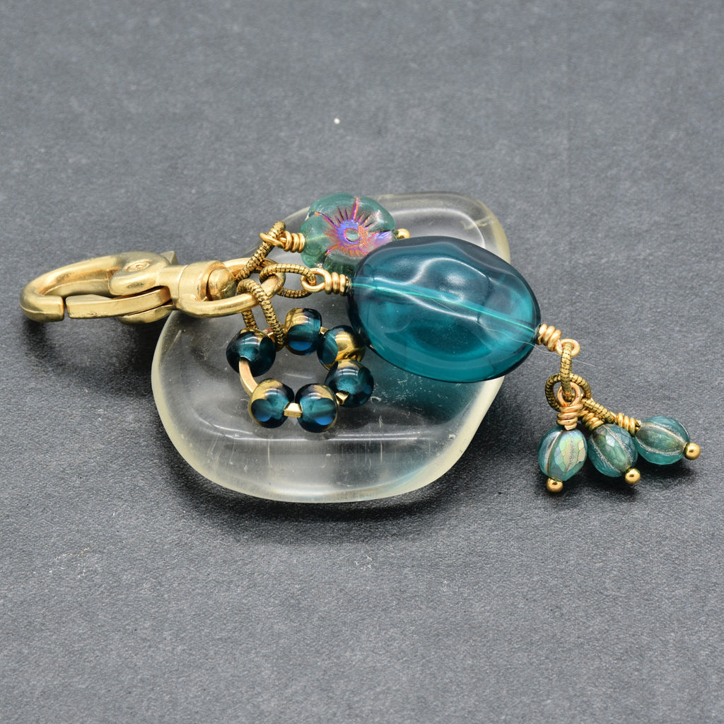 Aqua Blue handbag charm with gold swivel lobster claw on a gray background - handmade with love by Ruby Acorn