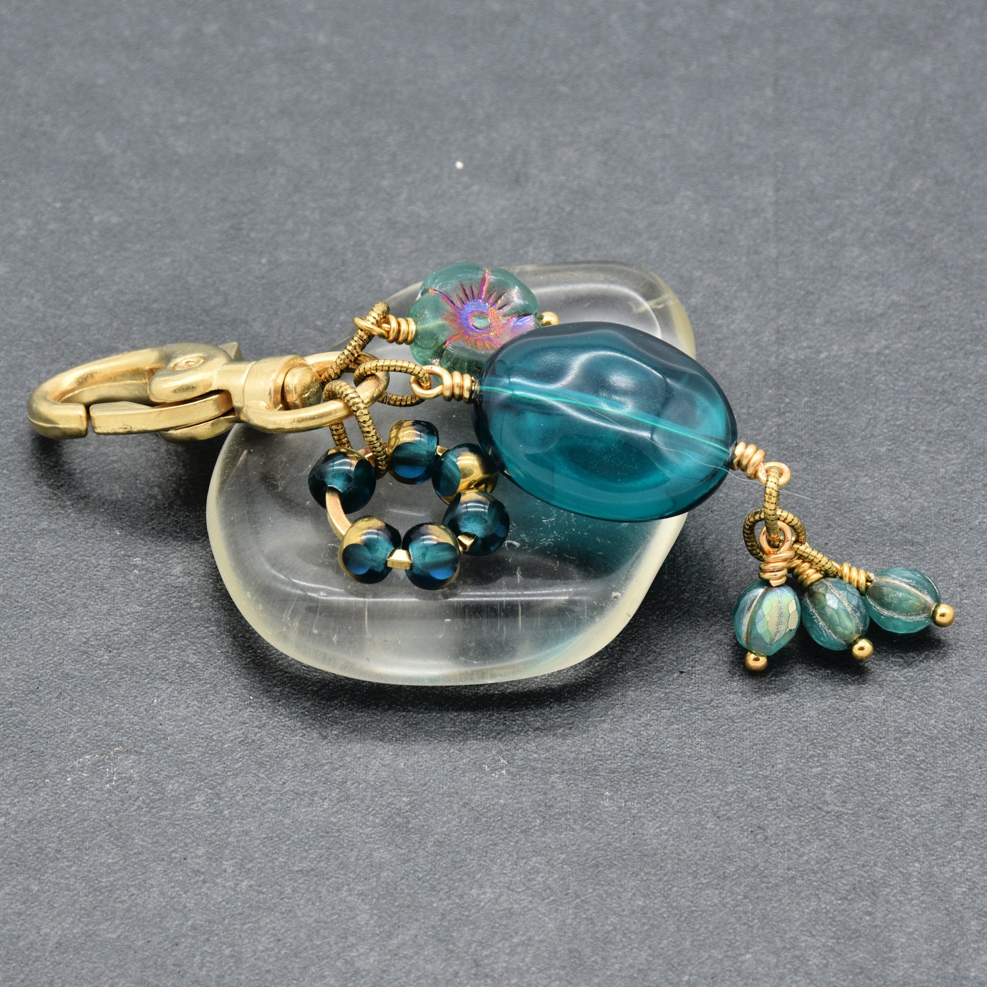 Aqua Blue handbag charm with gold swivel lobster claw on a gray background - handmade with love by Ruby Acorn