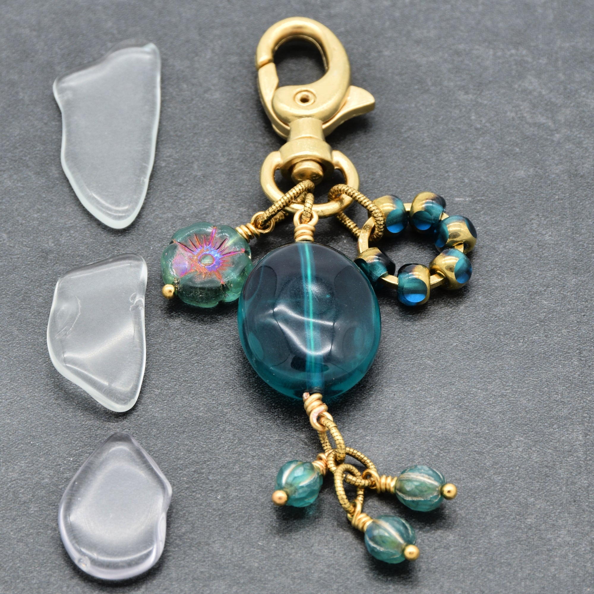 Aqua Blue handbag charm with gold swivel lobster claw on a gray background - handmade with love by Ruby Acorn