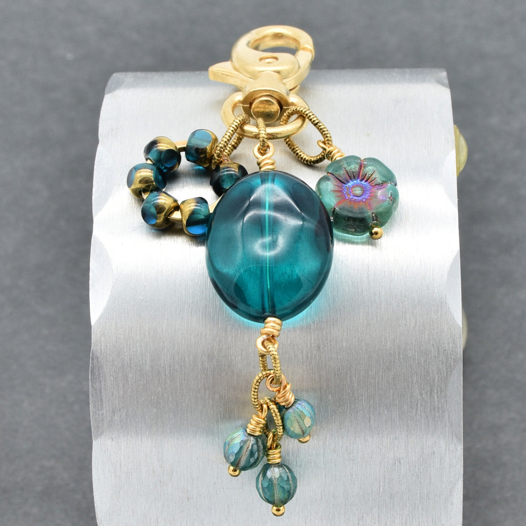 Aqua Blue handbag charm with gold swivel lobster claw on a gray background - handmade with love by Ruby Acorn