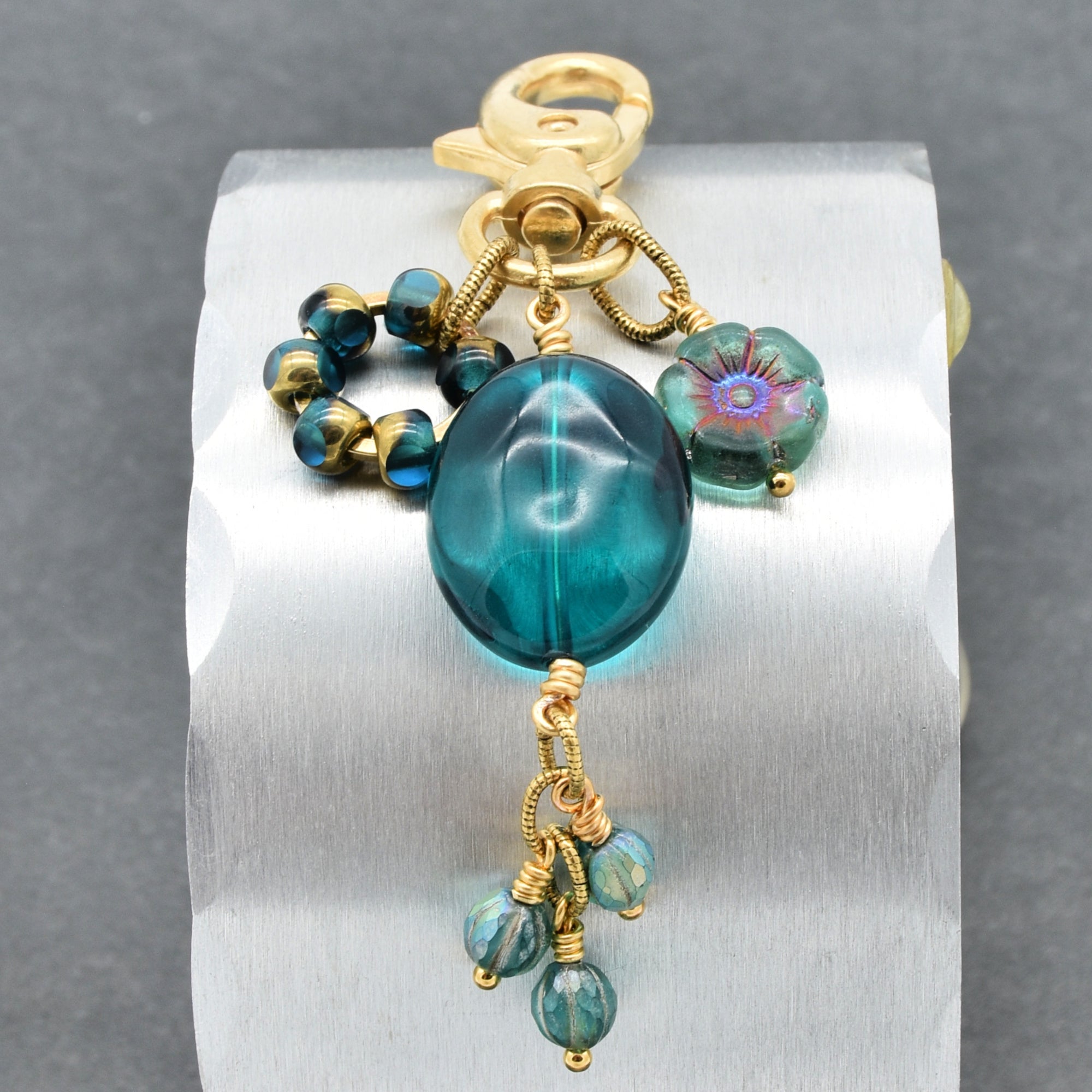 Aqua Blue handbag charm with gold swivel lobster claw on a gray background - handmade with love by Ruby Acorn