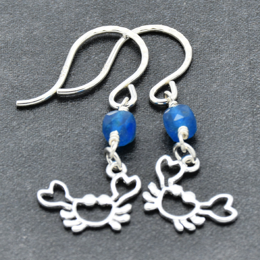 Sterling silver dangle earrings with crab charms, apatite, and silver ear wires on a gray surface - handmade with love by Ruby Acorn