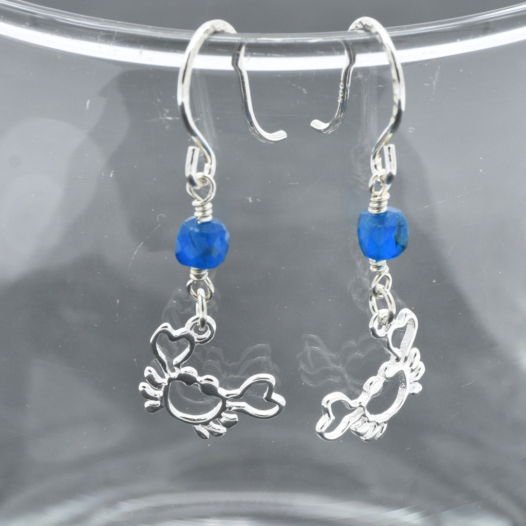 Sterling silver dangle earrings with crab charms, apatite, and silver ear wires on a glass surface - handmade with love by Ruby Acorn