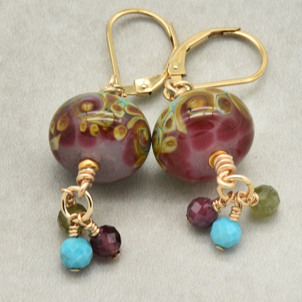 Colorful lampwork glass earrings with tourmaline and turquoise charms and gold filled lever back ear wires
