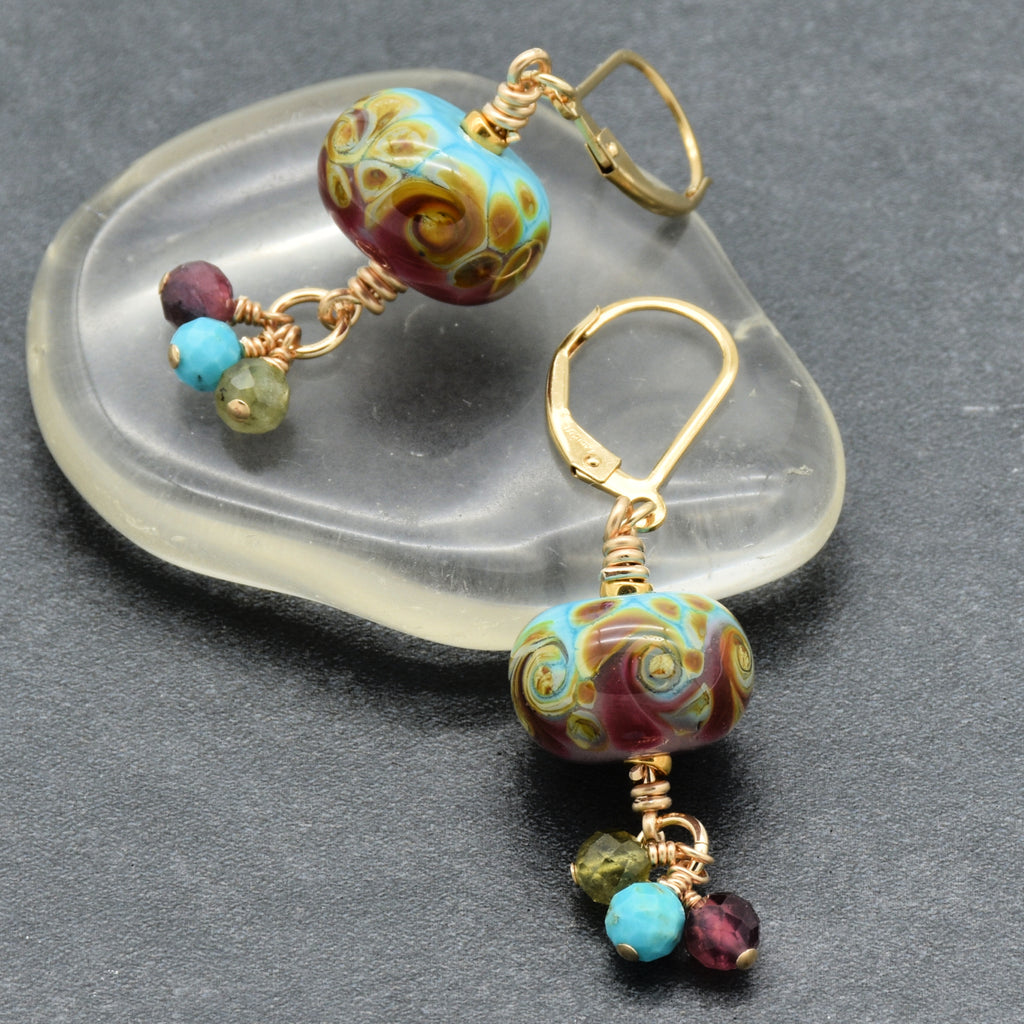 Colorful dangle earrings made the pink and blue lampwork glass and gold components