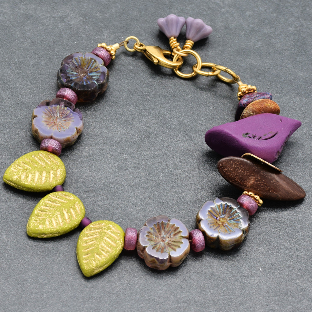 Colorful beaded bracelet on a gray surface