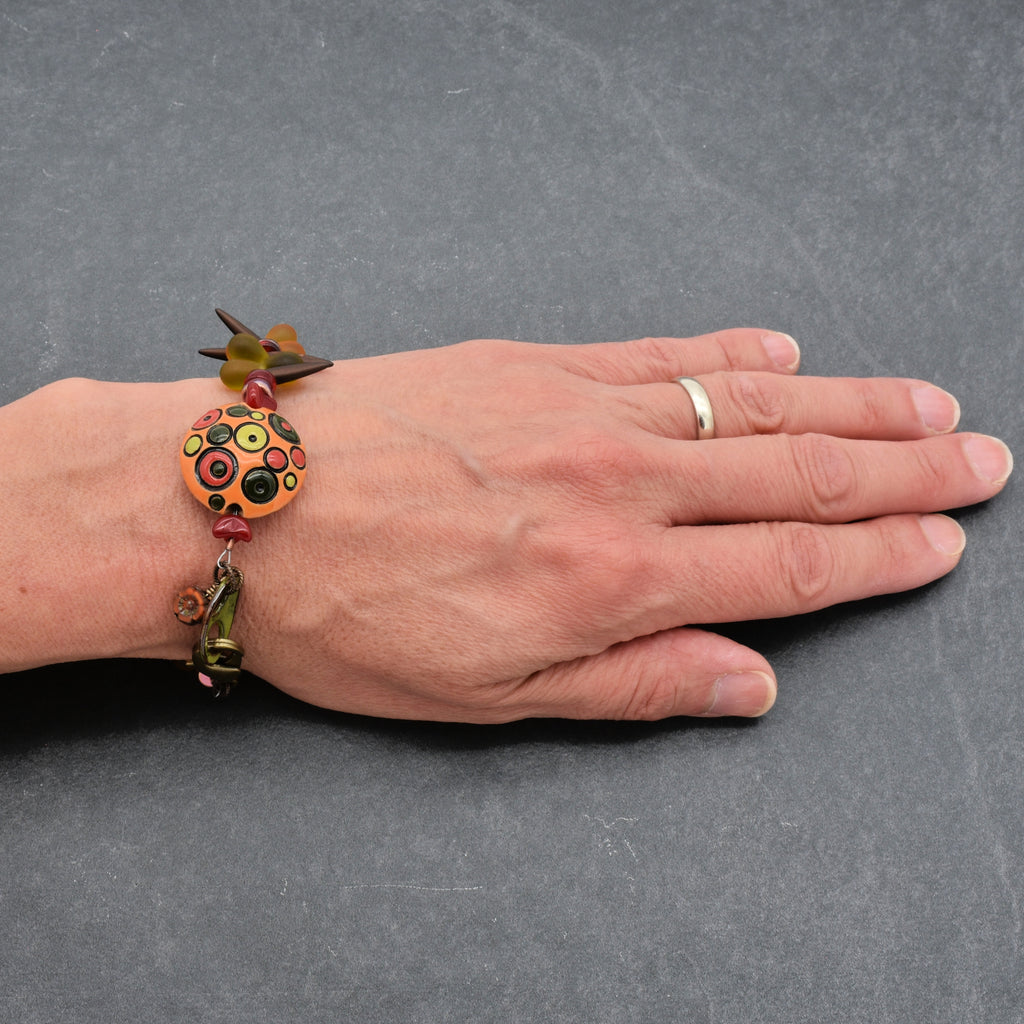 Circles and Spikes Handmade Beaded Bracelet with Artisan Ceramic Focal, Artisan Enameled Link and Czech Glass