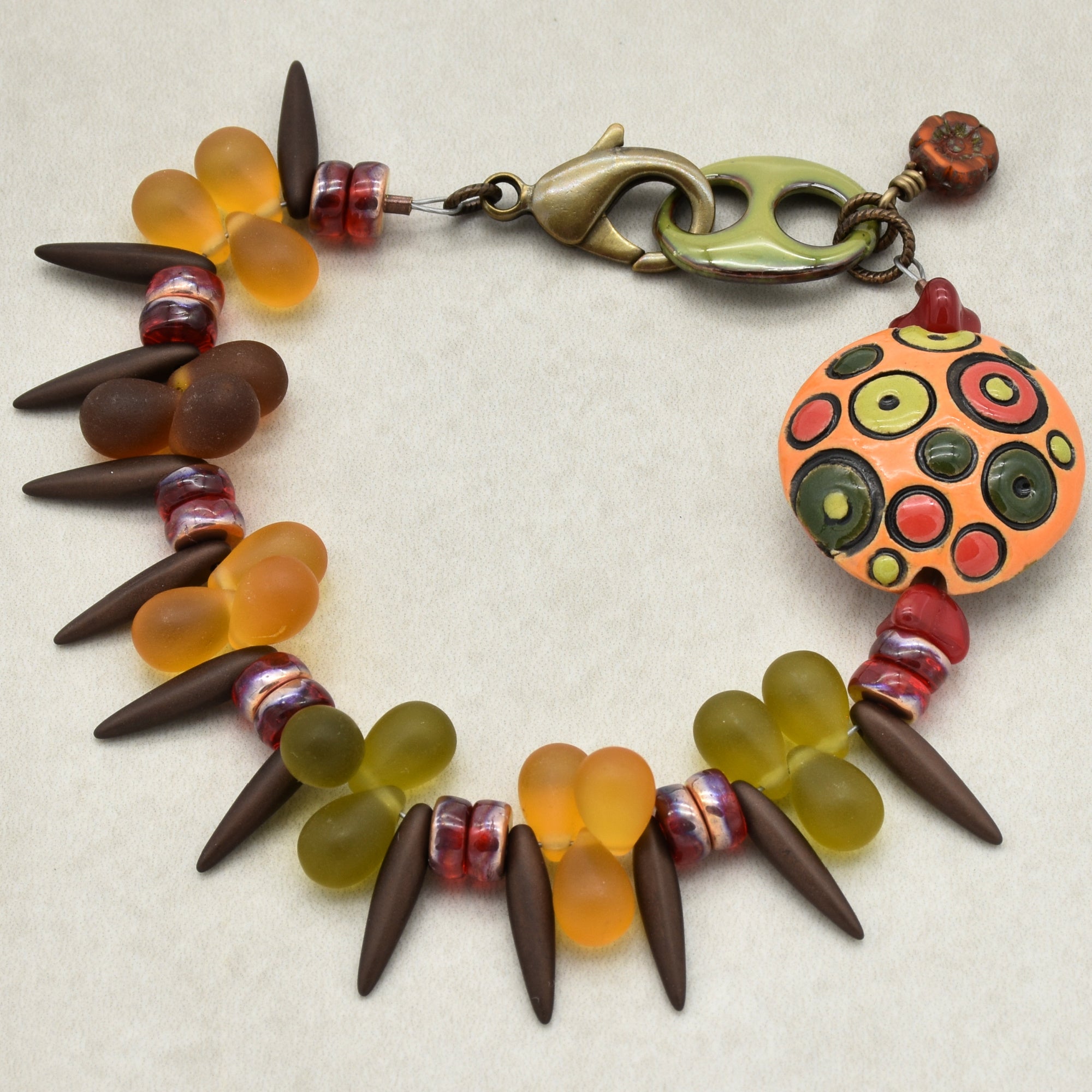 Circles and Spikes Handmade Beaded Bracelet with Artisan Ceramic Focal, Artisan Enameled Link and Czech Glass