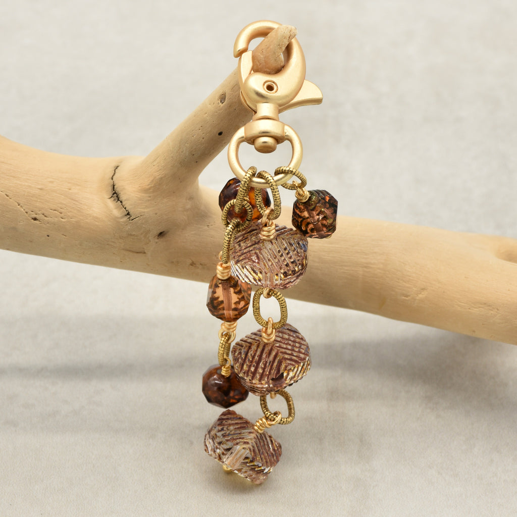 Smoky Reverie Handbag Charm featuring wire-wrapped etched Czech glass rondelles in smoky topaz with gold lobster claw, handmade by Ruby Acorn