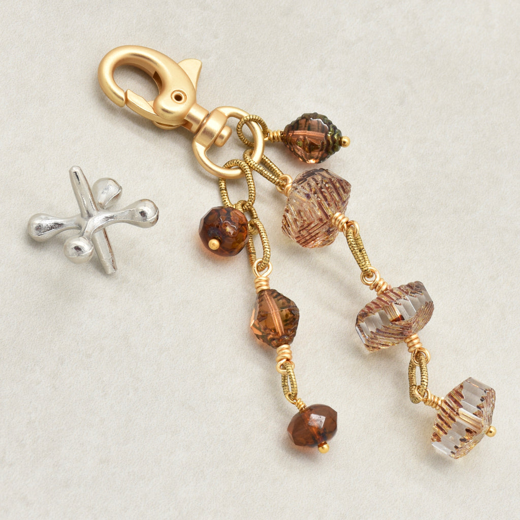 Smoky Reverie Handbag Charm featuring wire-wrapped etched Czech glass rondelles in smoky topaz with gold lobster claw, handmade by Ruby Acorn