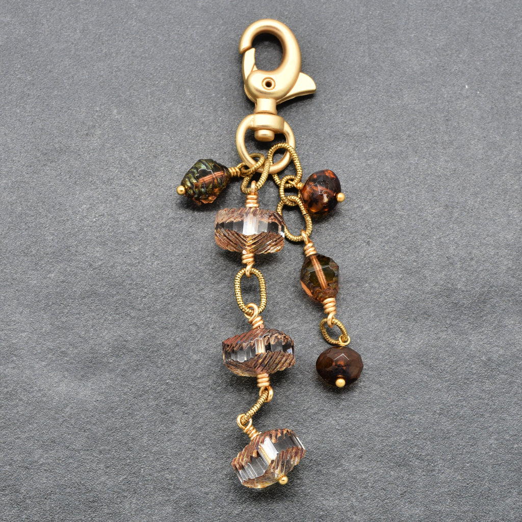 Smoky Reverie Handbag Charm featuring wire-wrapped etched Czech glass rondelles in smoky topaz with gold lobster claw, handmade by Ruby Acorn