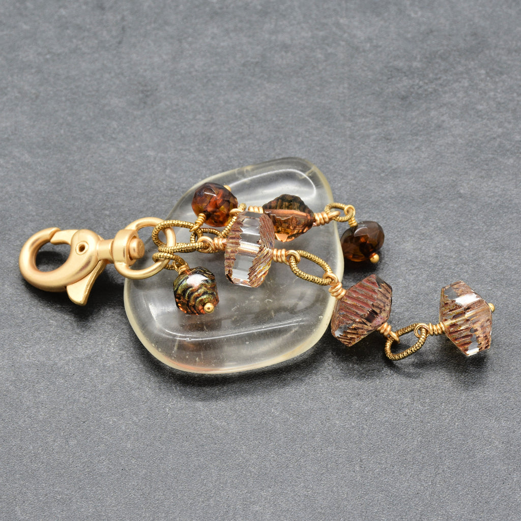 Smoky Reverie Handbag Charm featuring wire-wrapped etched Czech glass rondelles in smoky topaz with gold lobster claw, handmade by Ruby Acorn