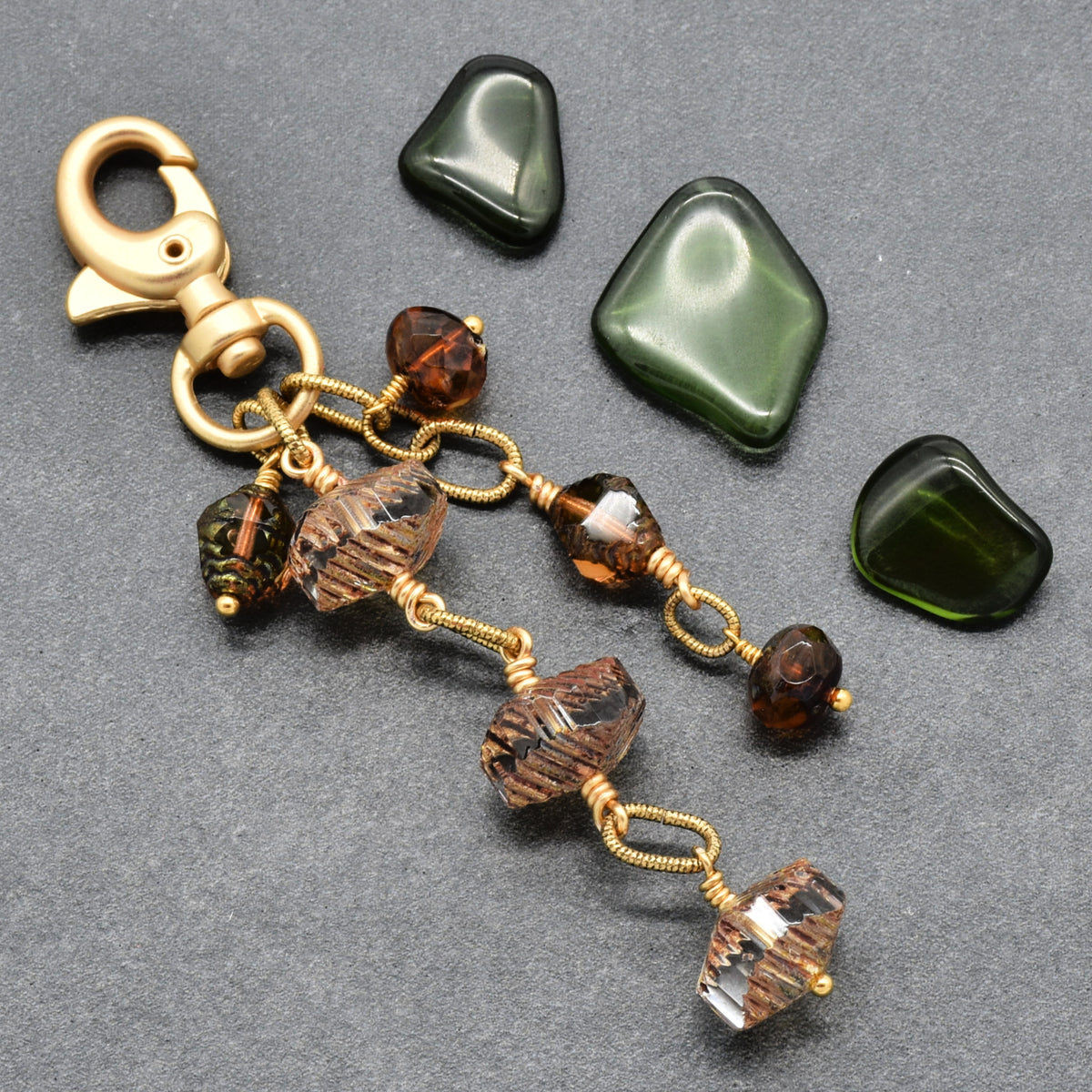 Smoky Reverie Handbag Charm featuring wire-wrapped etched Czech glass rondelles in smoky topaz with gold lobster claw, handmade by Ruby Acorn
