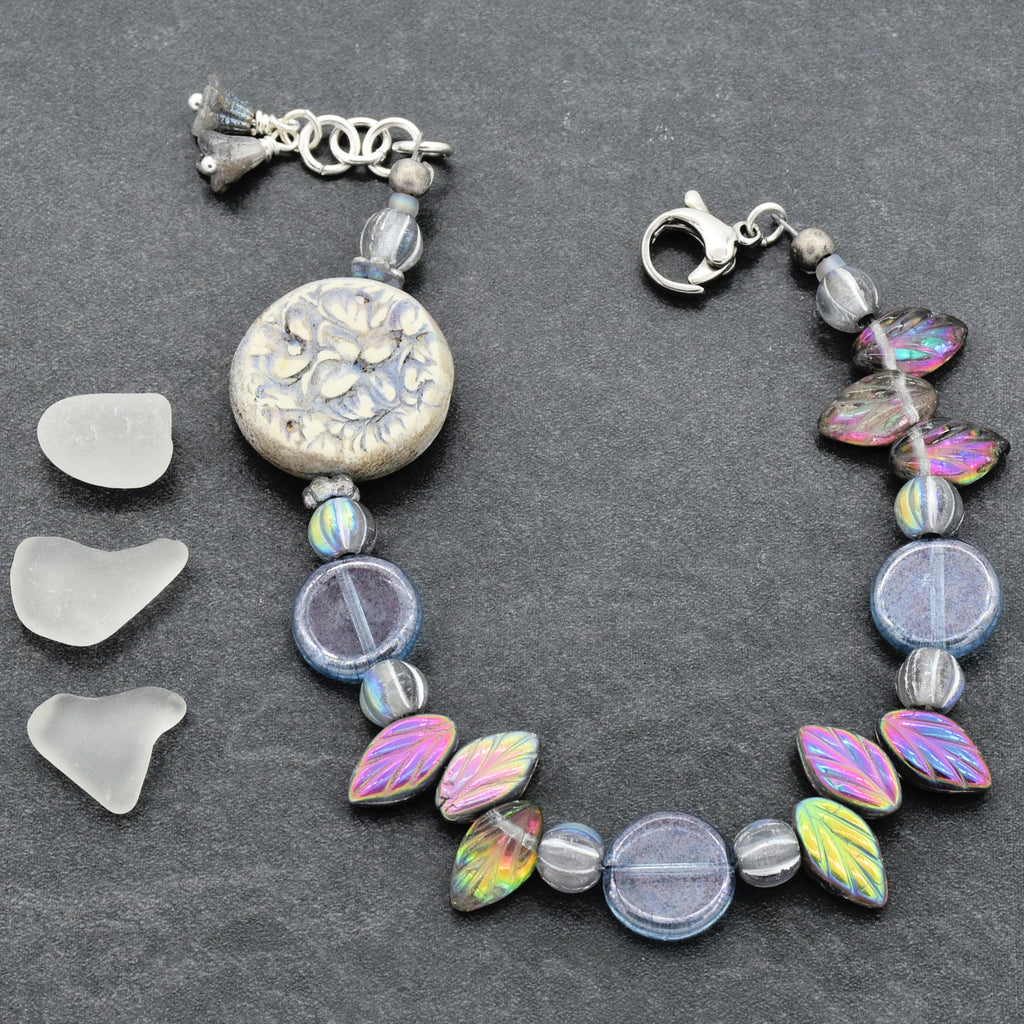 Bracelet with decorative beads on a gray surface