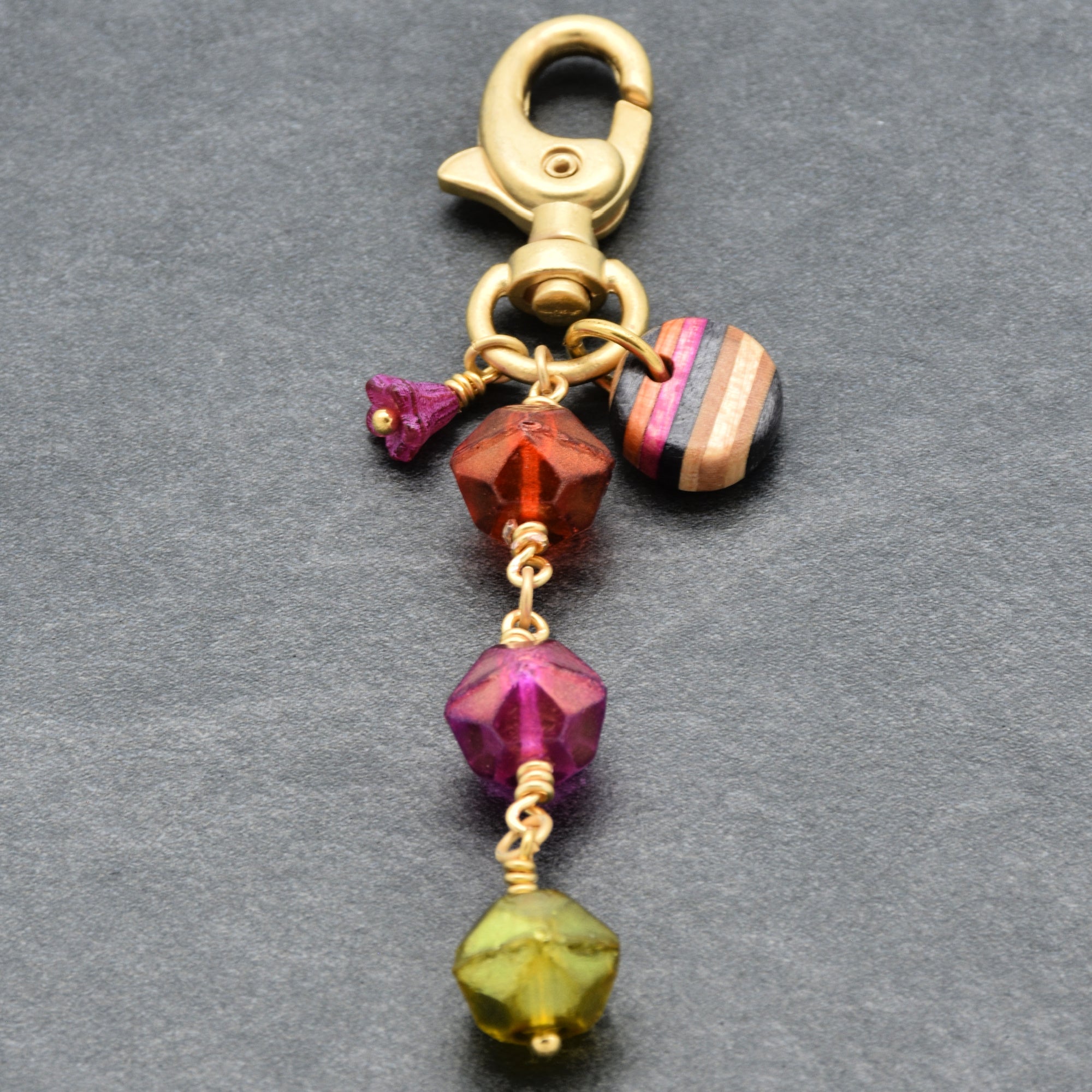 Decorative keychain with colorful neon beads on a gray background - Ruby Acorn one of a kind wearable art