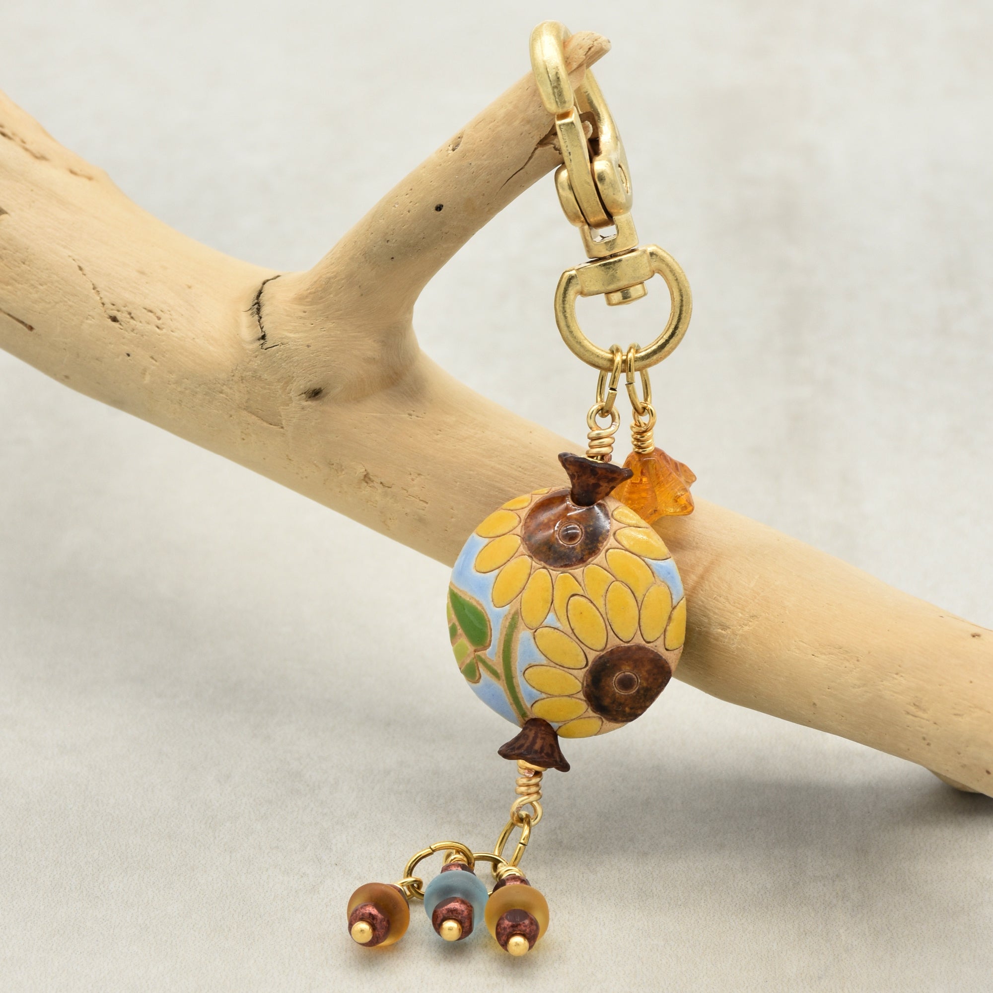 Colorful sunflower handbag charm with gold swivel lobster clasp on a branch - handmade with love by Ruby Acorn