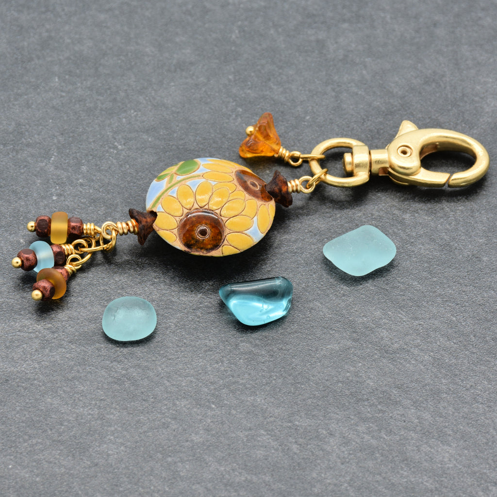 Colorful sunflower handbag charm with gold swivel lobster clasp on a gray background - handmade with love by Ruby Acorn