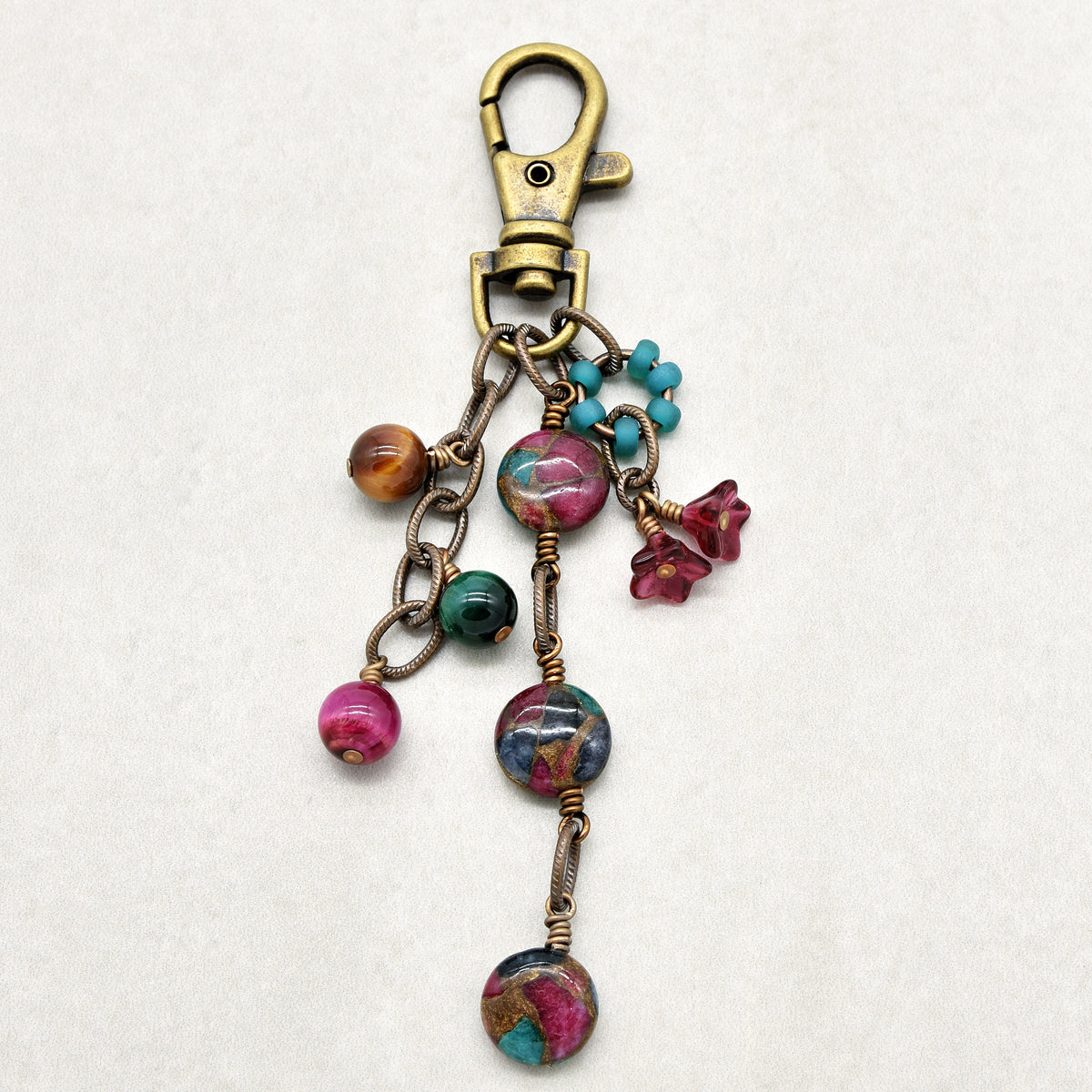 Mosaic in Bloom Handbag Charm featuring mosaic agate bead with fuchsia, turquoise and earth tones, handmade by Ruby Acorn