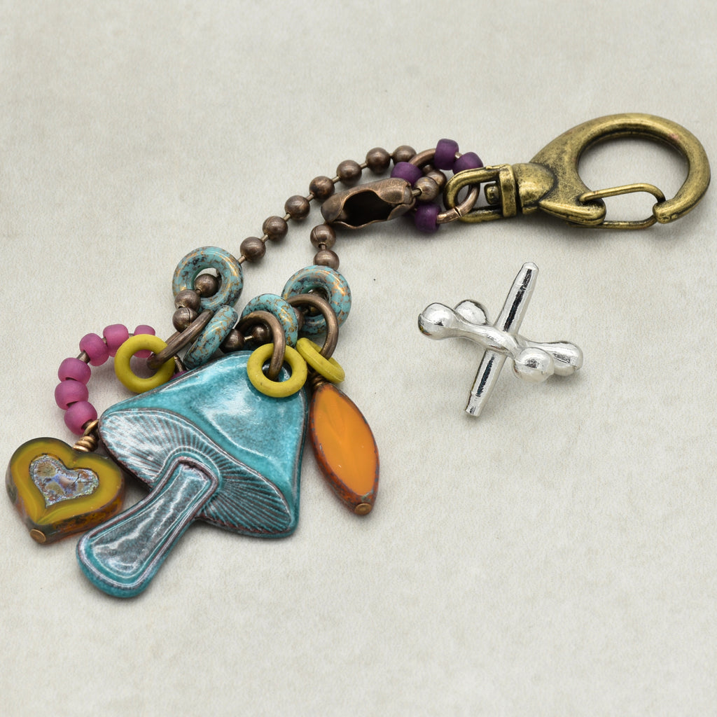 Colorful keychain with various charms on a light background