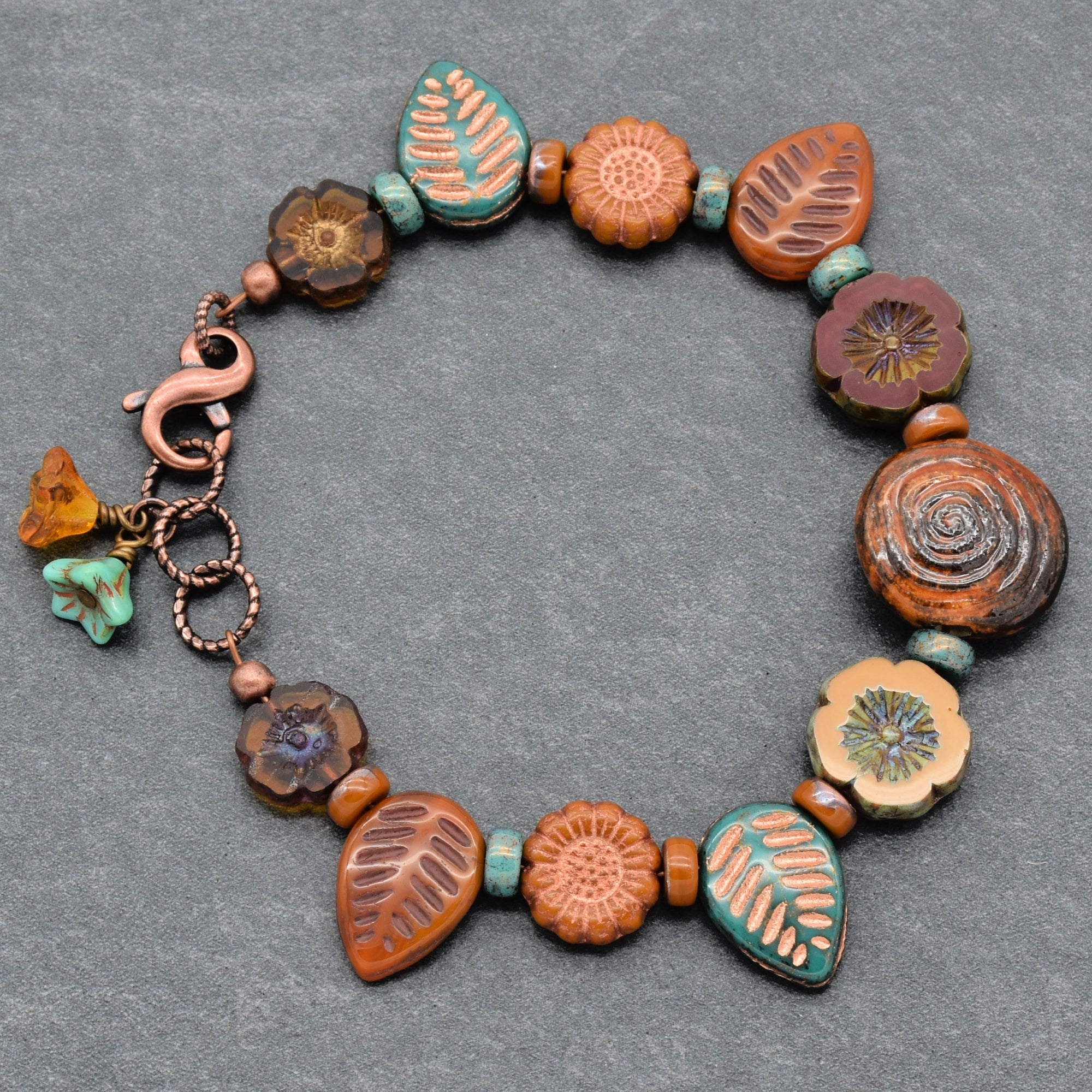 Bracelet with ceramic beads on a gray background