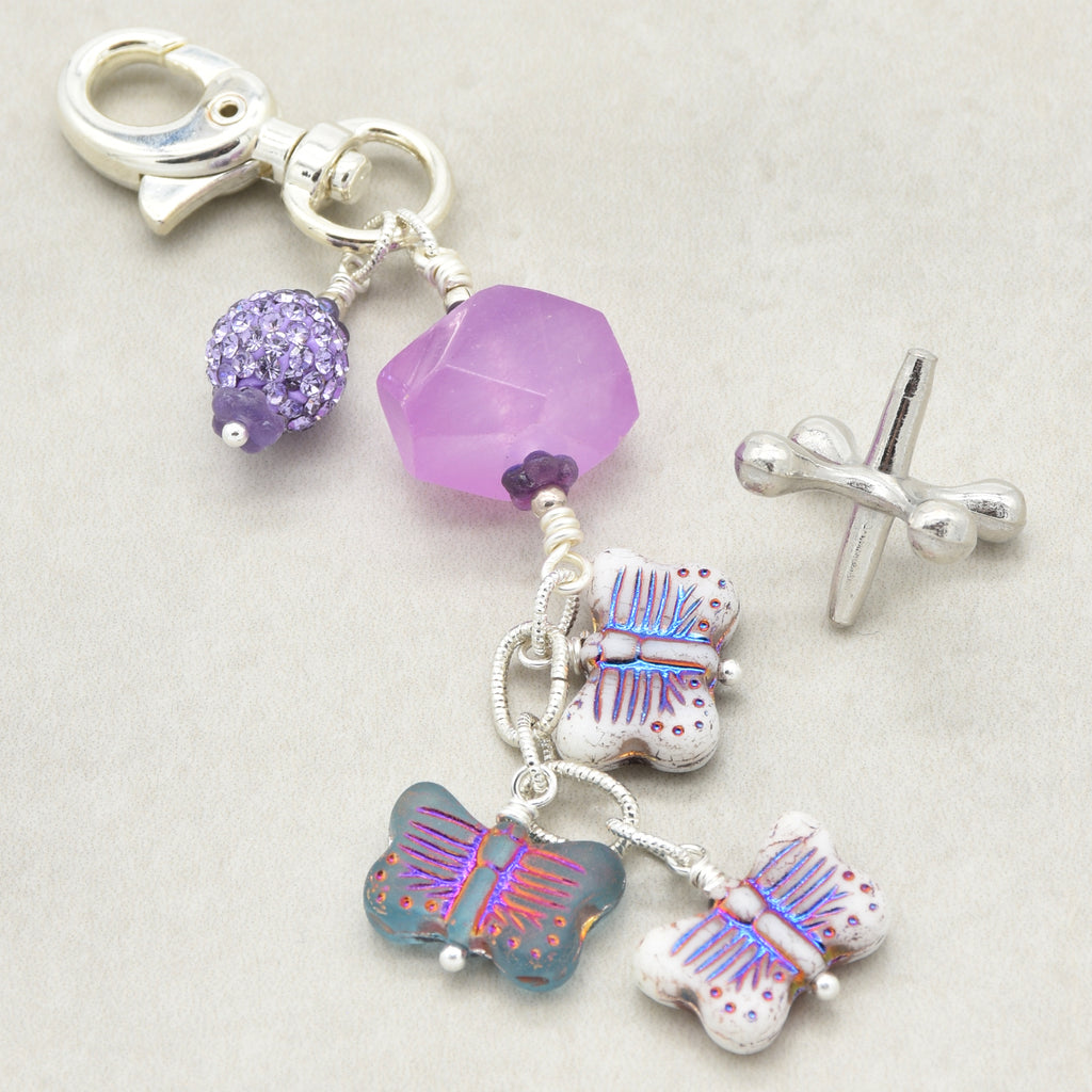 Lilac quartz handbag charm with butterfly charms on a light background - handmade with love by Ruby Acorn