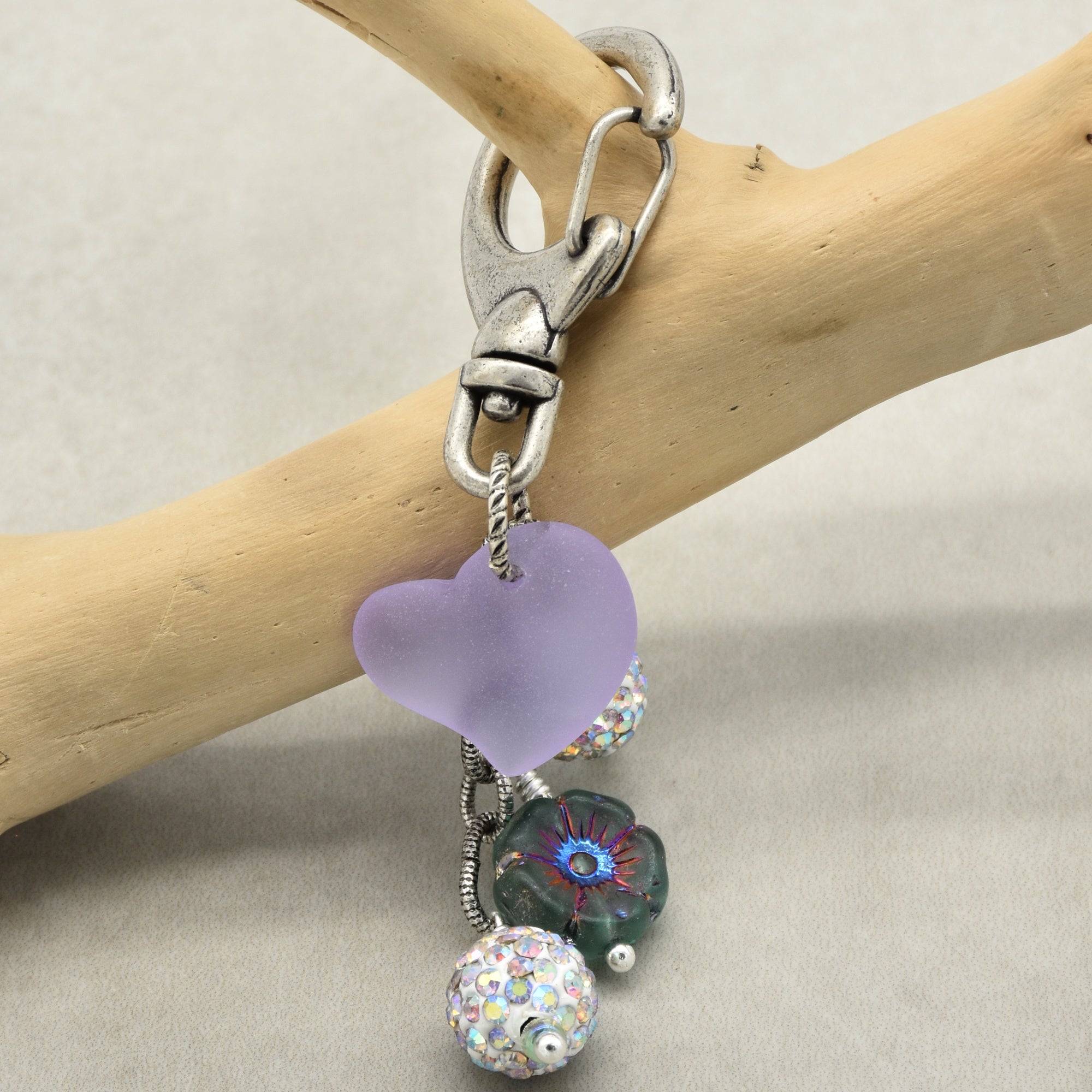 Keychain with heart-shaped and floral beads on a branch