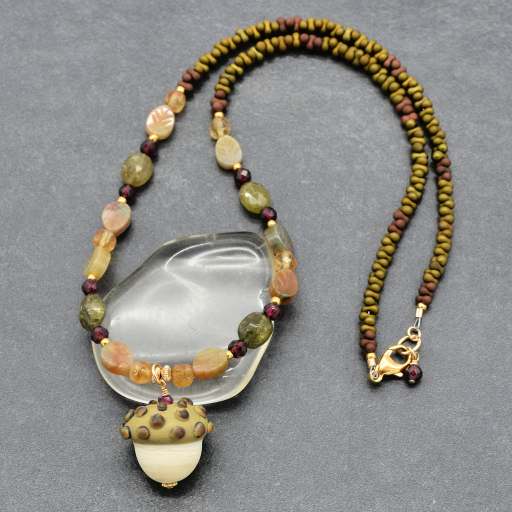 Forest Fable Necklace featuring artisan lampwork glass acorn focal with green garnet, red garnet and citrine, handmade by Ruby Acorn