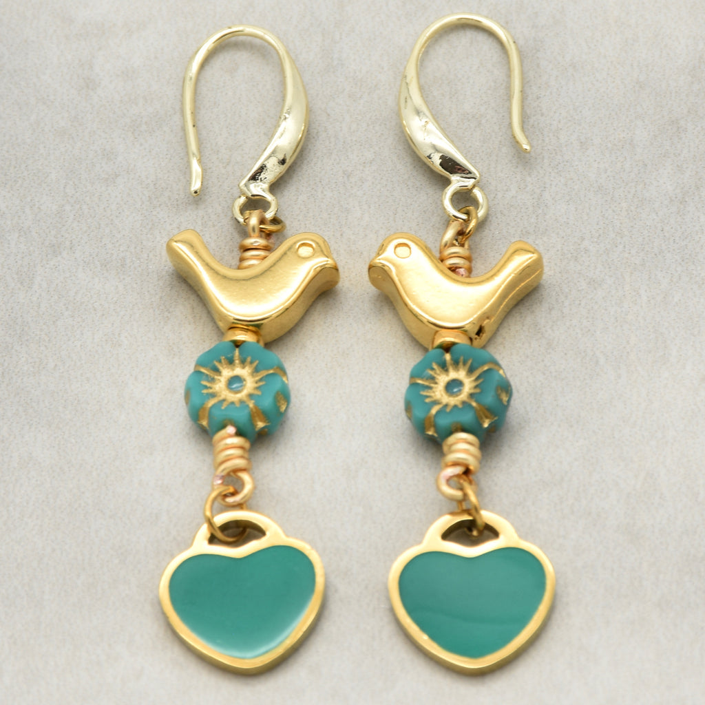 Lovebirds Turquoise Blue dangle earrings with gold birds and heart charms on a light background - handmade with love by Ruby Acorn