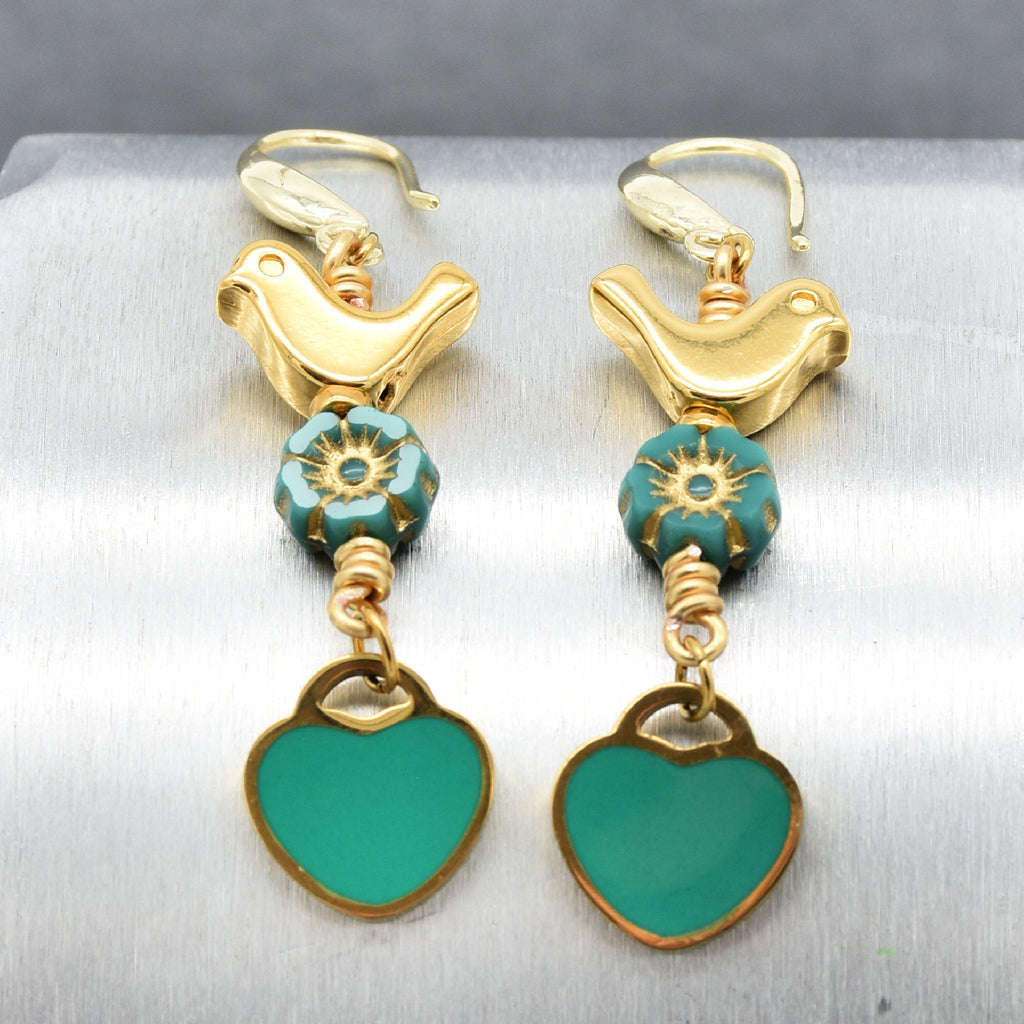Lovebirds Turquoise Blue dangle earrings with gold birds and heart charms on a silver background - handmade with love by Ruby Acorn