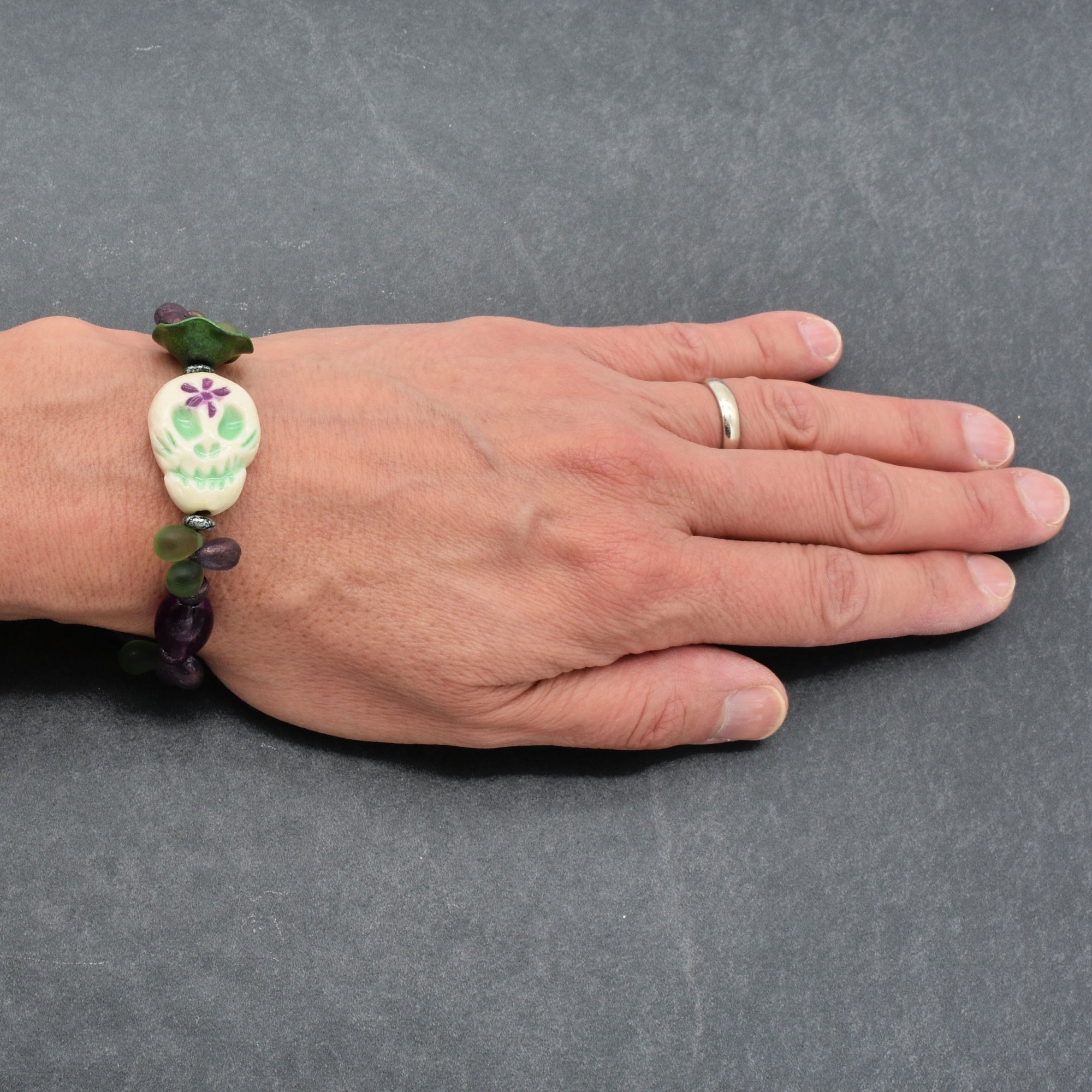 Fabulous Purple and Green Mardi Gras Catrina Handmade Beaded Bracelet with Artisan Ceramic Sugar Skull, Artisan Enameled Link and Rainbow Fluorite
