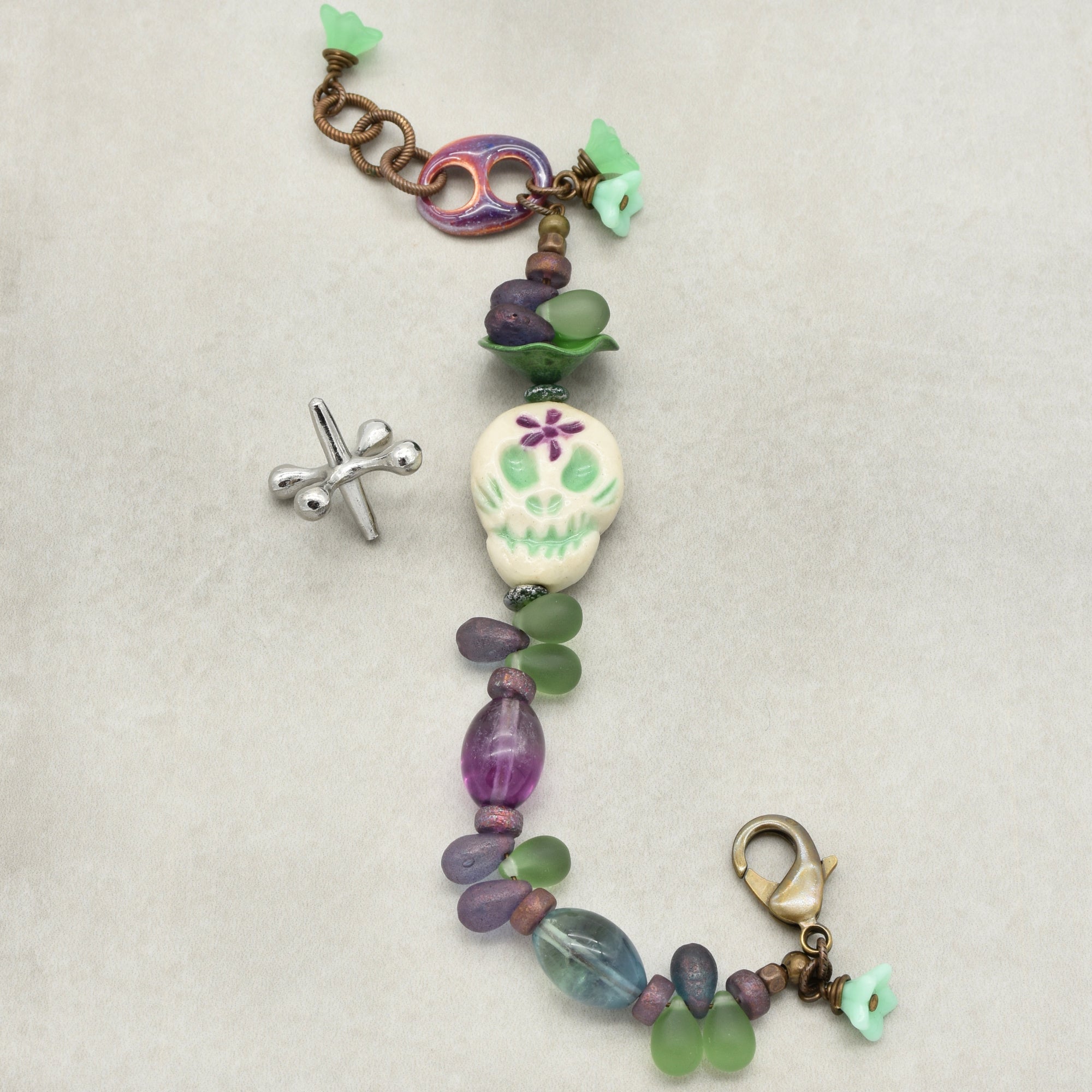 Fabulous Purple and Green Mardi Gras Catrina Handmade Beaded Bracelet with Artisan Ceramic Sugar Skull, Artisan Enameled Link and Rainbow Fluorite