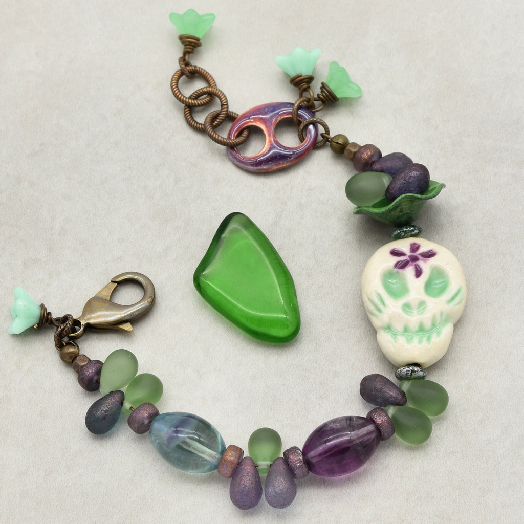 Fabulous Purple and Green Mardi Gras Catrina Handmade Beaded Bracelet with Artisan Ceramic Sugar Skull, Artisan Enameled Link and Rainbow Fluorite