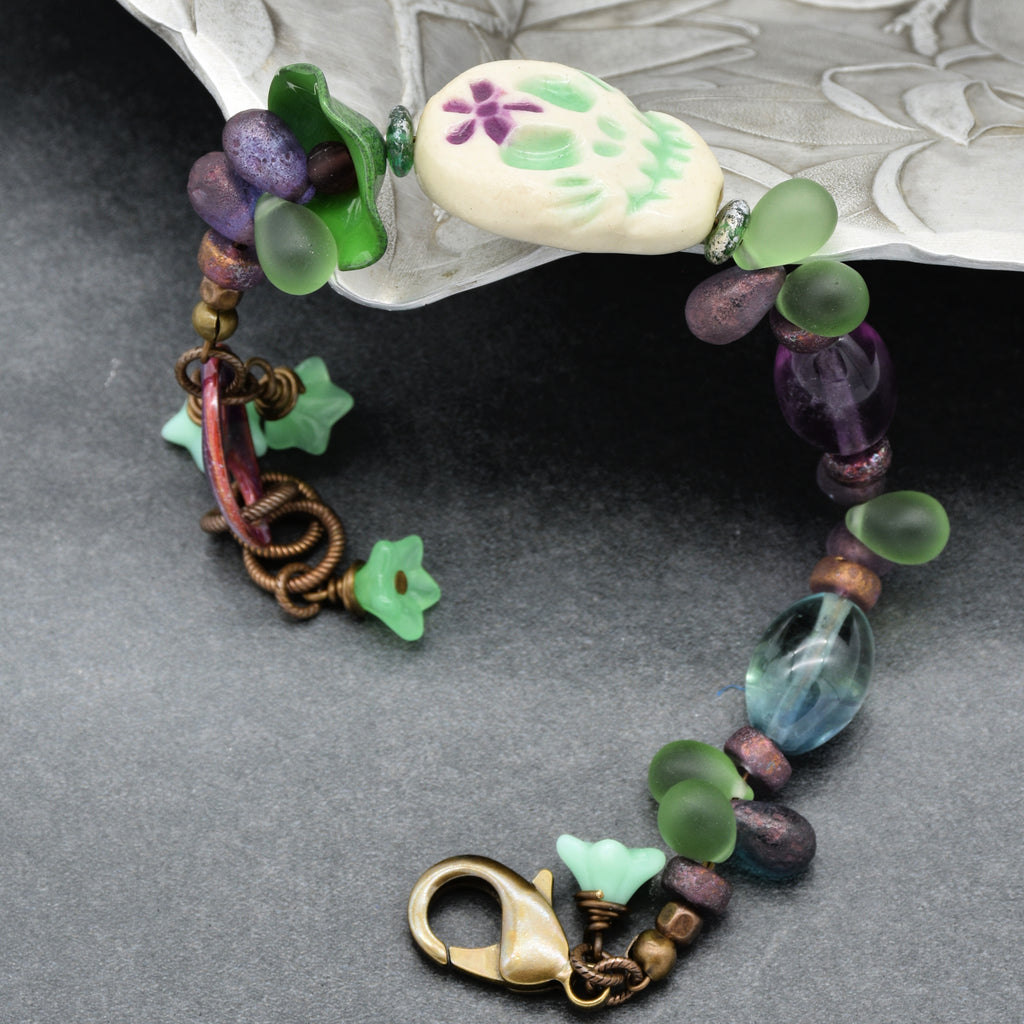 Fabulous Purple and Green Mardi Gras Catrina Handmade Beaded Bracelet with Artisan Ceramic Sugar Skull, Artisan Enameled Link and Rainbow Fluorite