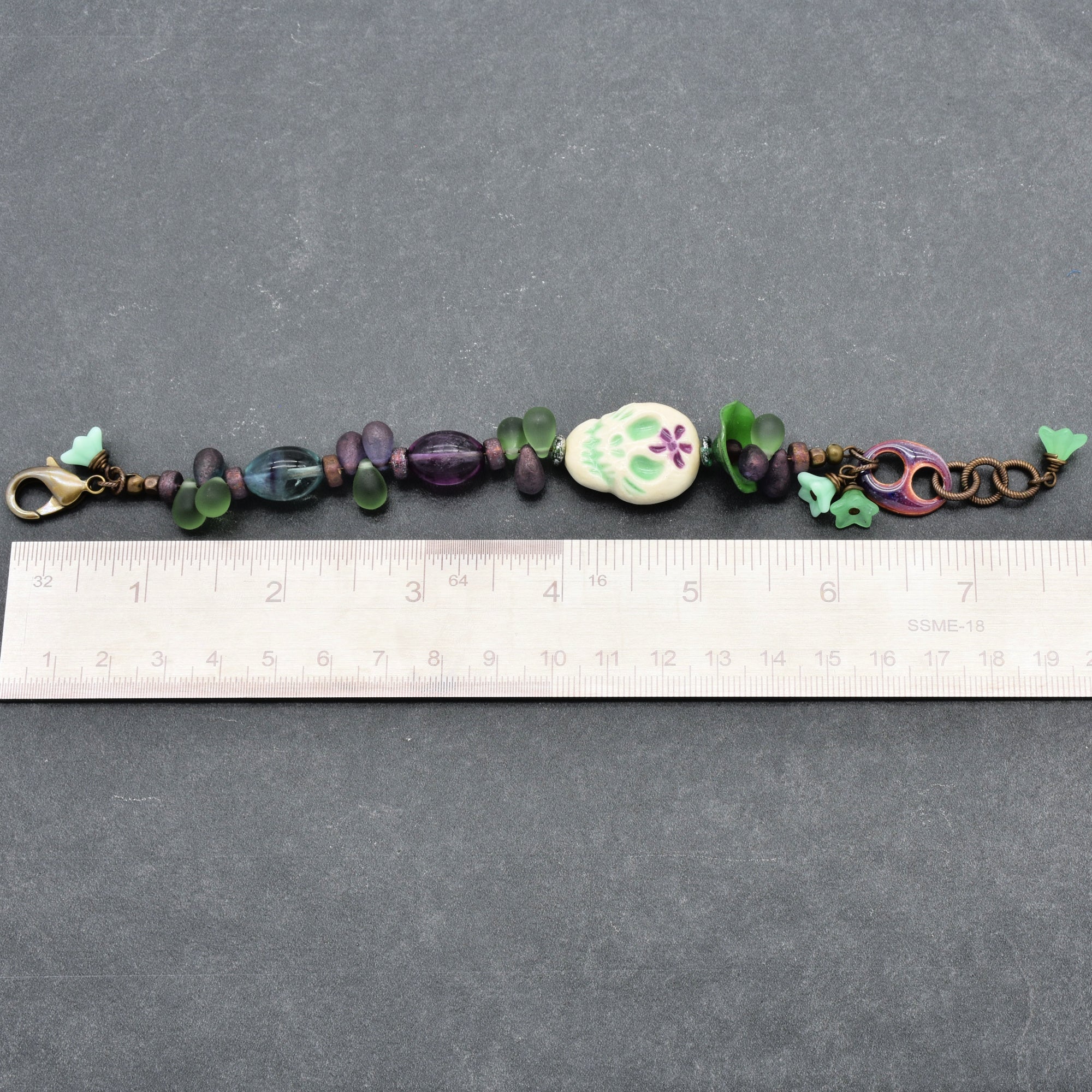 Fabulous Purple and Green Mardi Gras Catrina Handmade Beaded Bracelet with Artisan Ceramic Sugar Skull, Artisan Enameled Link and Rainbow Fluorite