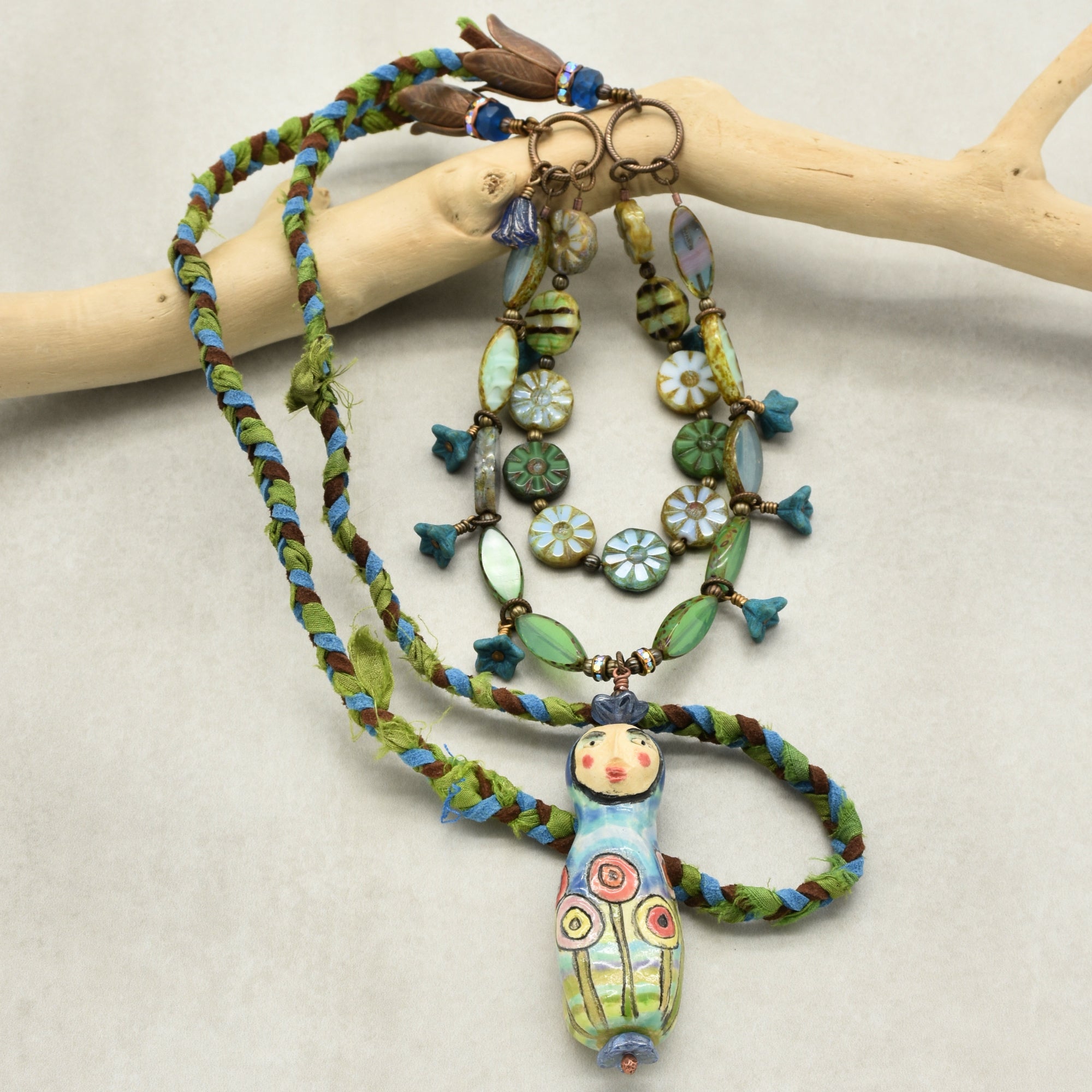 Colorful necklace with a unique pendant on a neutral background