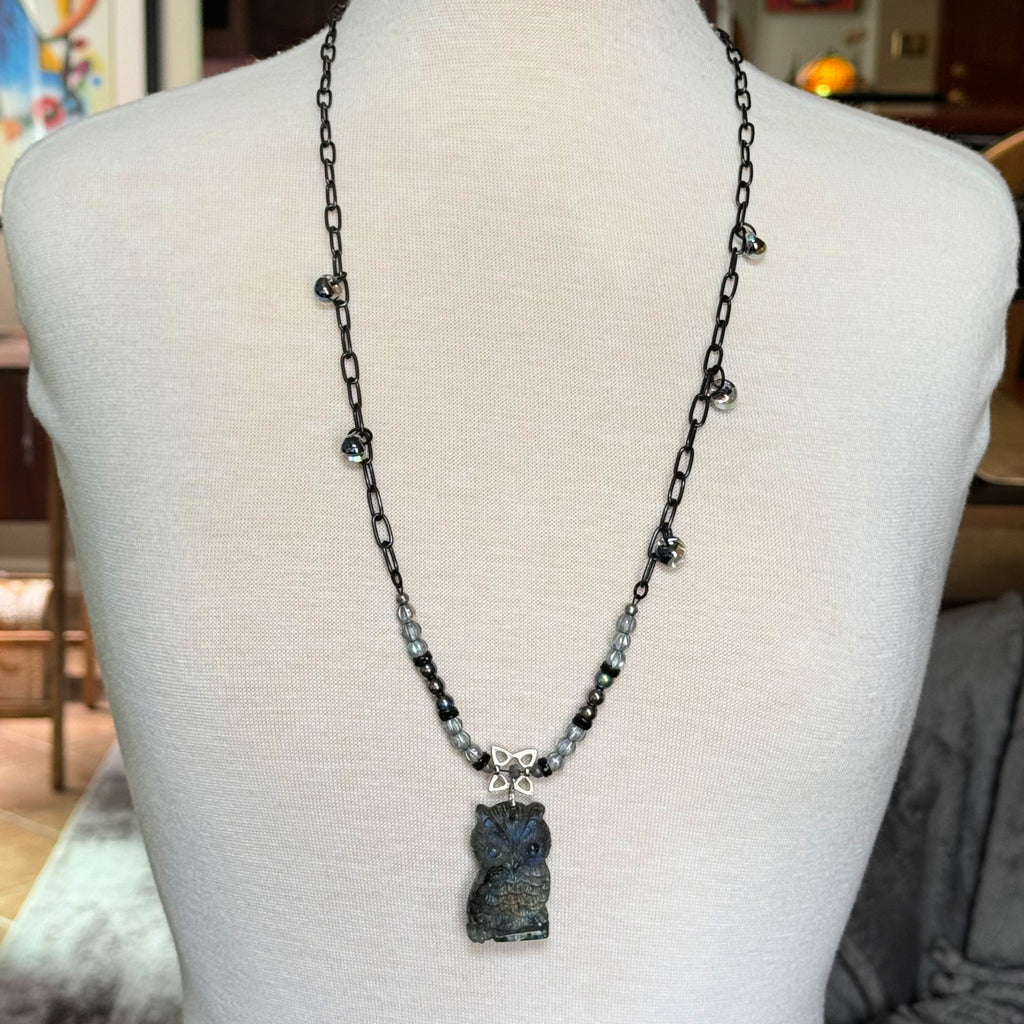 Mannequin wearing a longer necklace with a labradorite carved owl focal, Czech glass, lampwork glass teardrops and noir chain - made with love in Colorado by Ruby Acorn