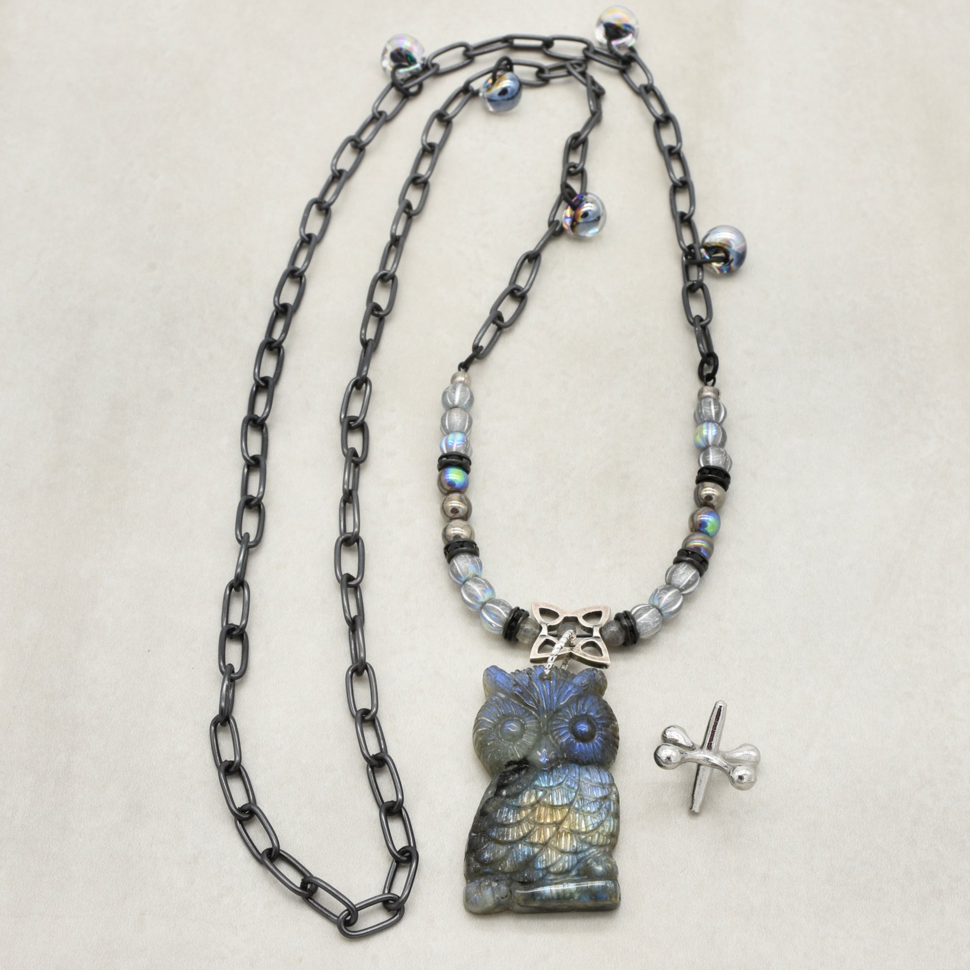 Longer necklace with a labradorite carved owl focal, Czech glass, and noir chain - hand crafted by Ruby Acorn