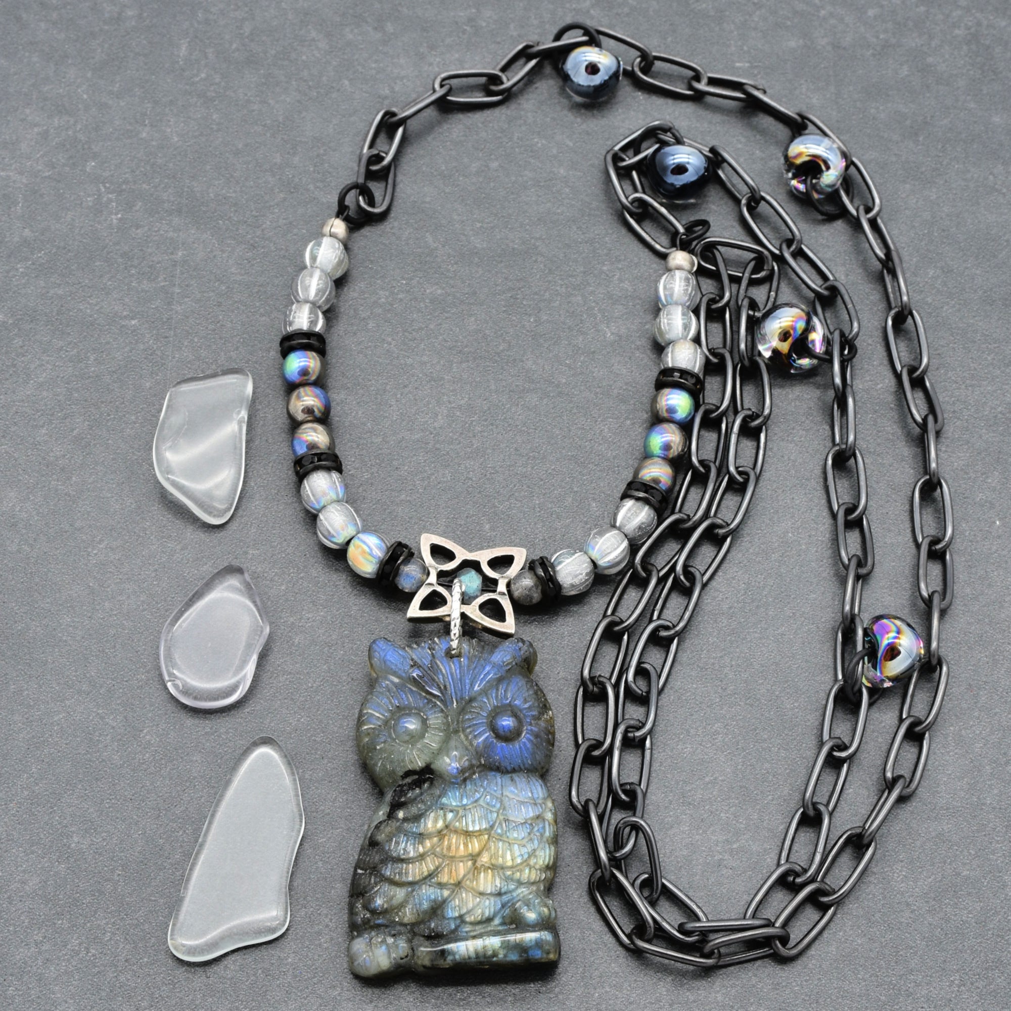 Close up of a necklace with a labradorite carved owl focal, Czech glass and noir chain - art you can wear by Ruby Acorn