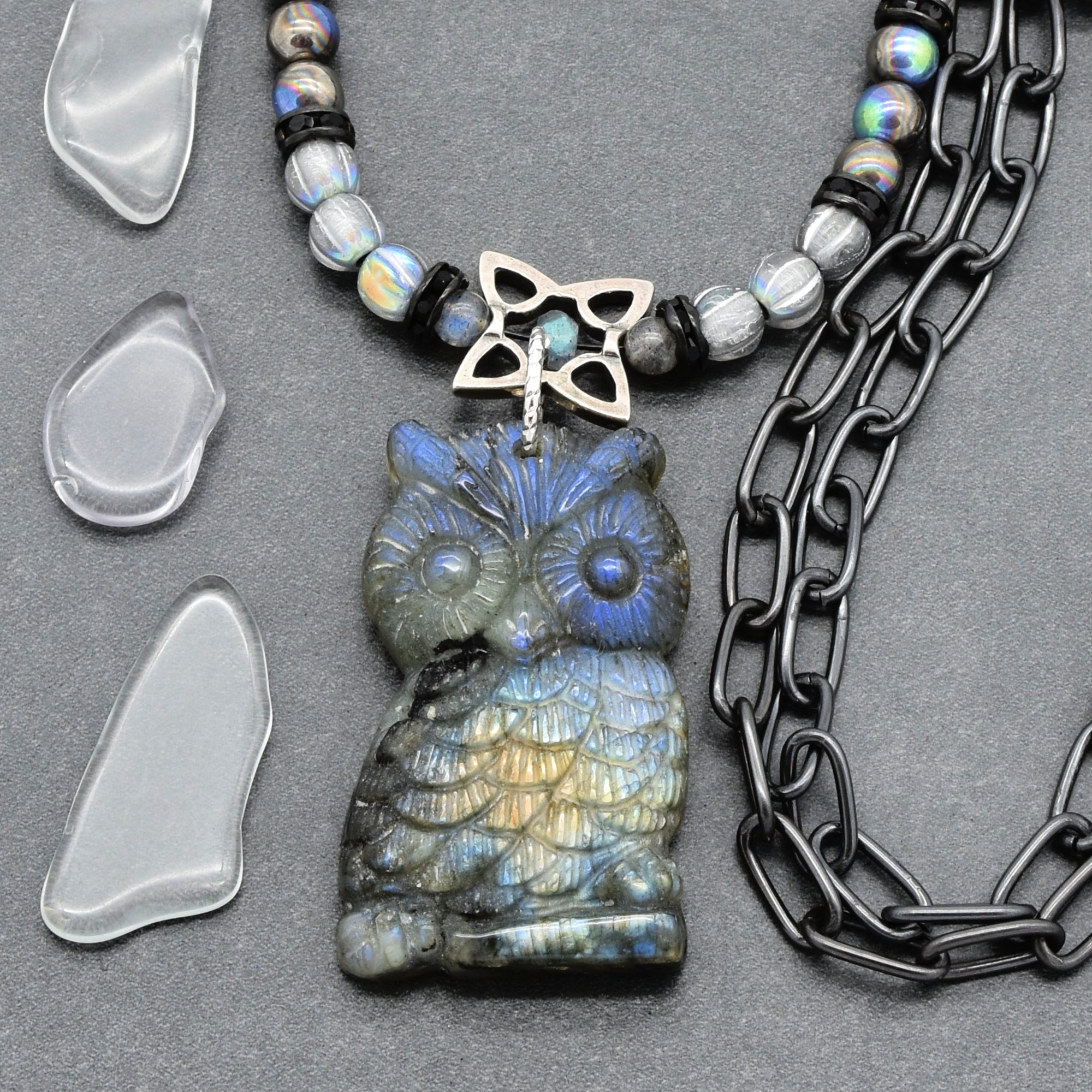 Close up of a necklace with a labradorite carved owl focal, with Czech glass, and noir chain - hand crafted in Colorado by Ruby Acorn